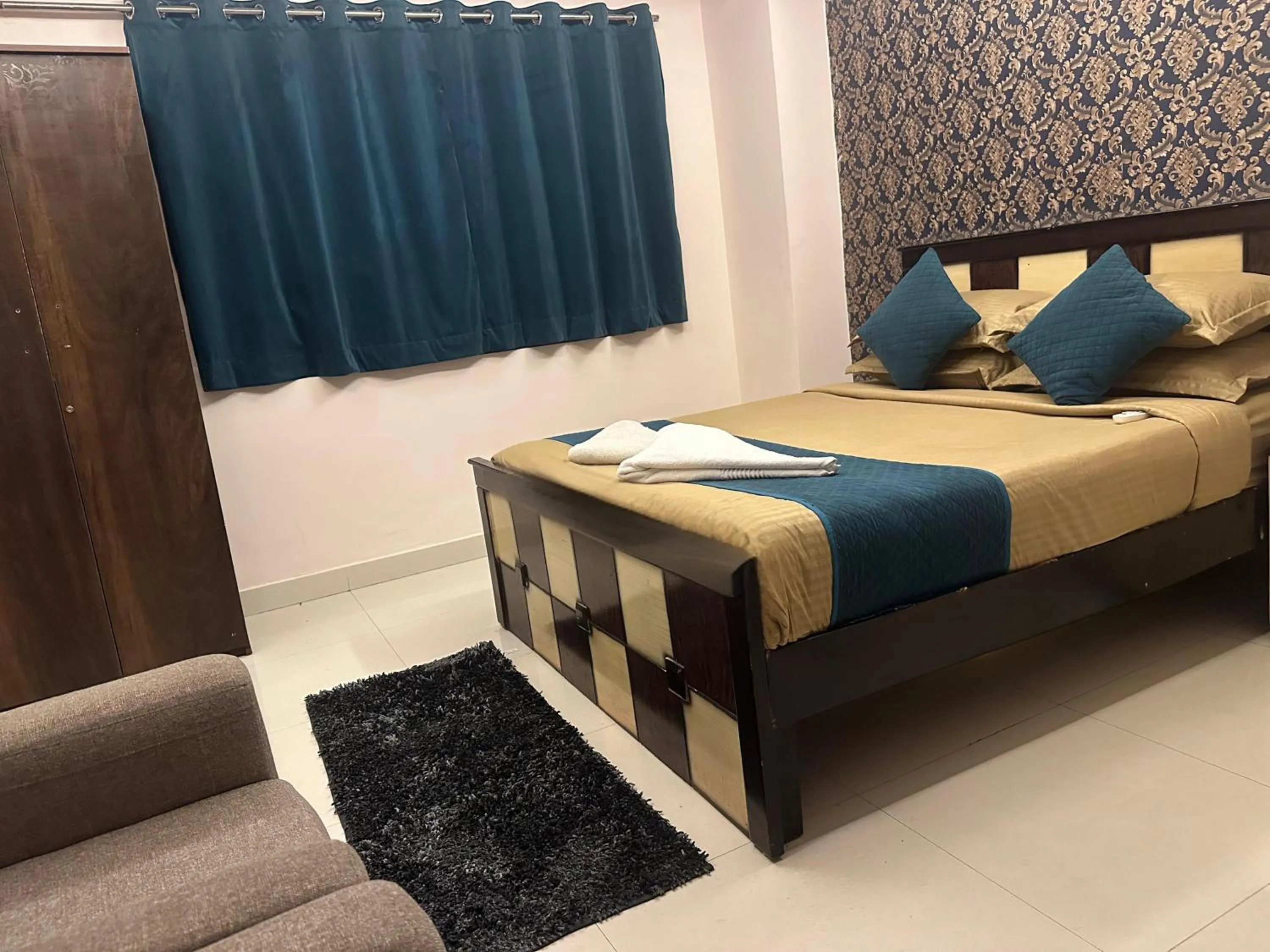 Bed in Blue Bliss Suites By PPH Living