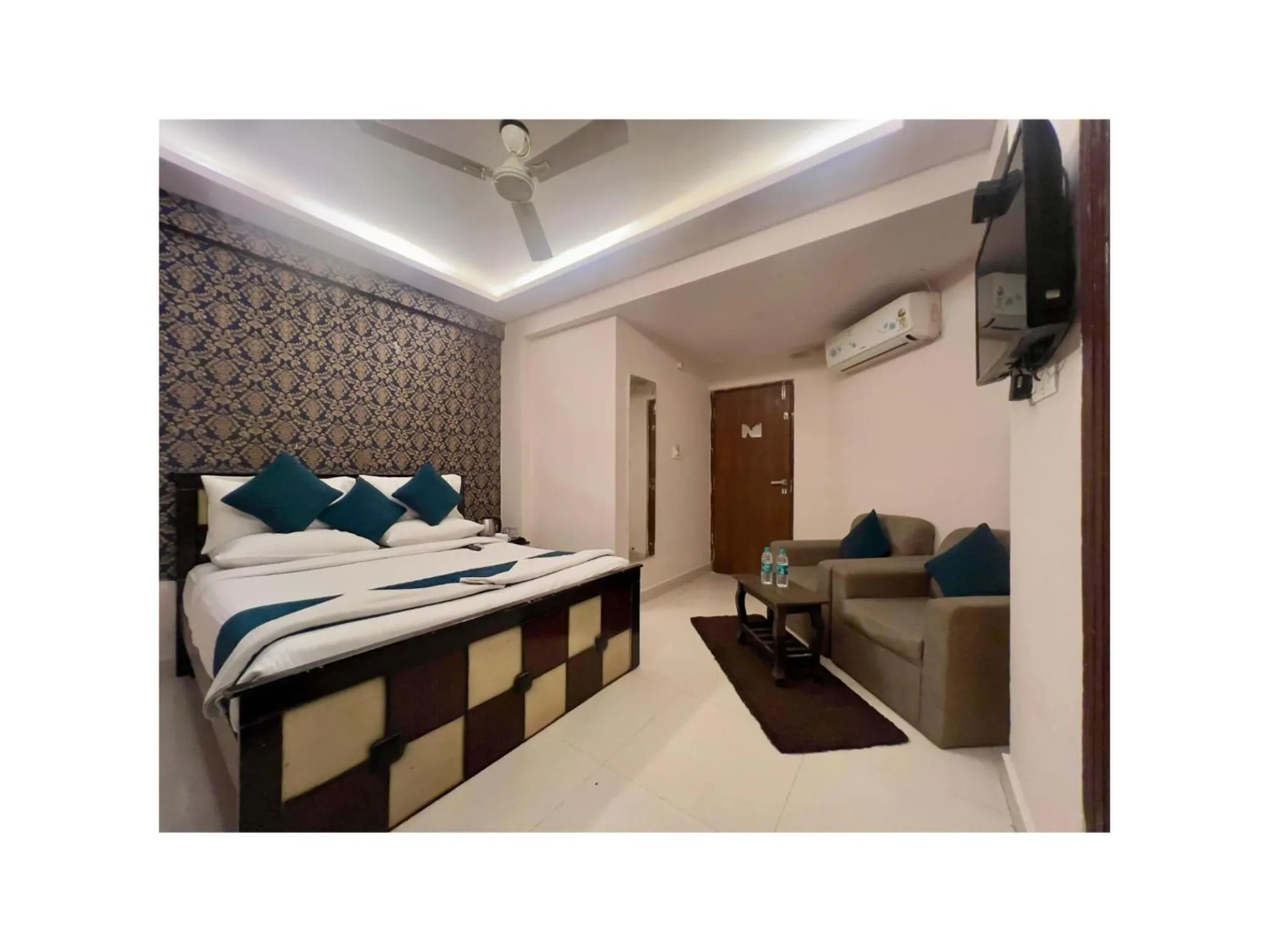 Bed in Blue Bliss Suites By PPH Living