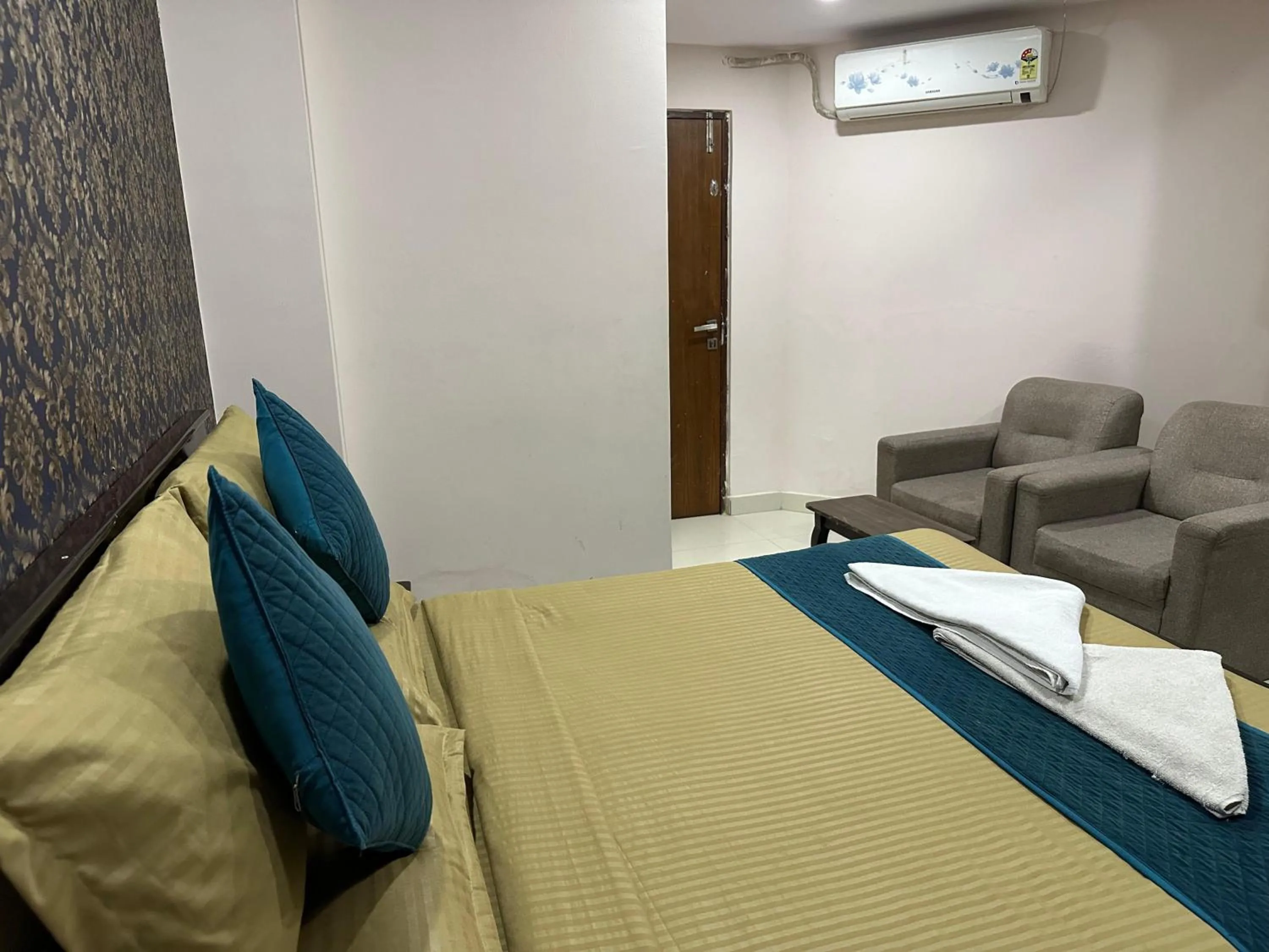 Bed in Blue Bliss Suites By PPH Living