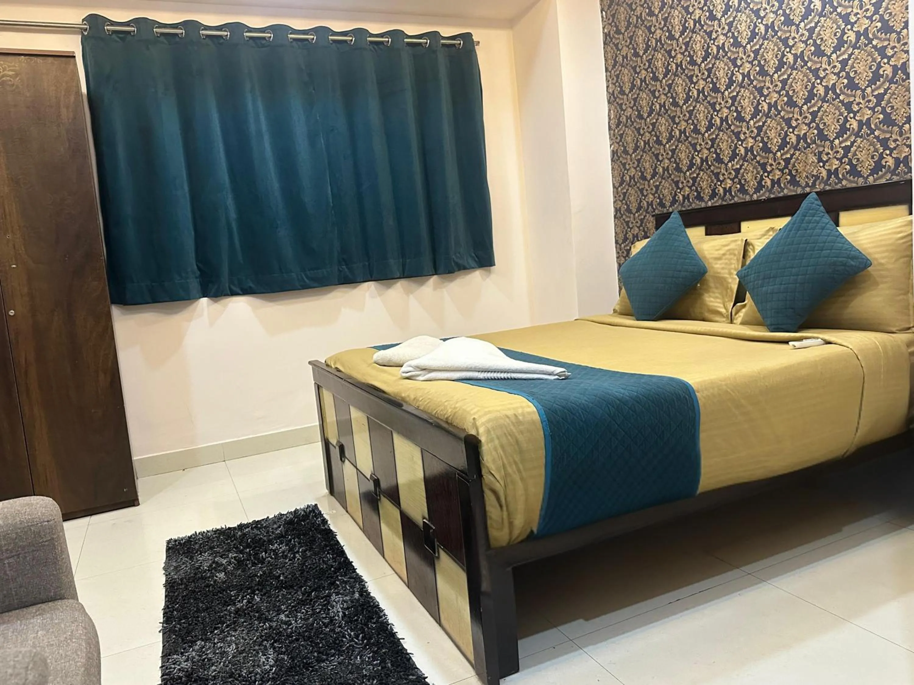 Bed in Blue Bliss Suites By PPH Living