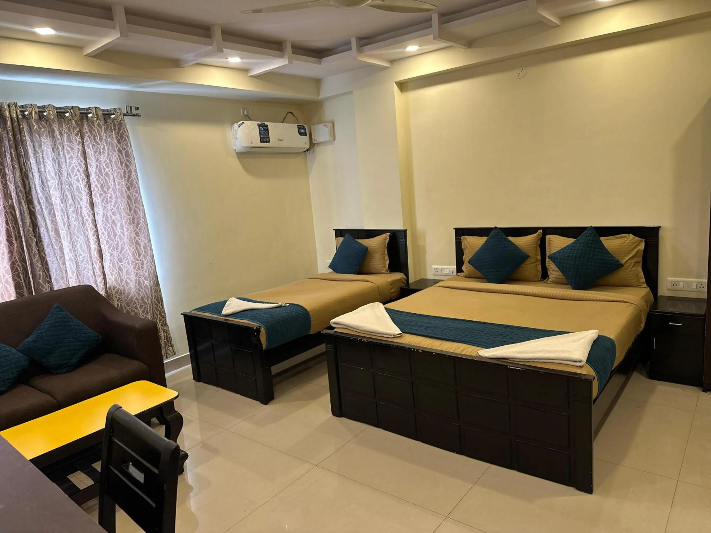Bed in Blue Bliss Suites By PPH Living