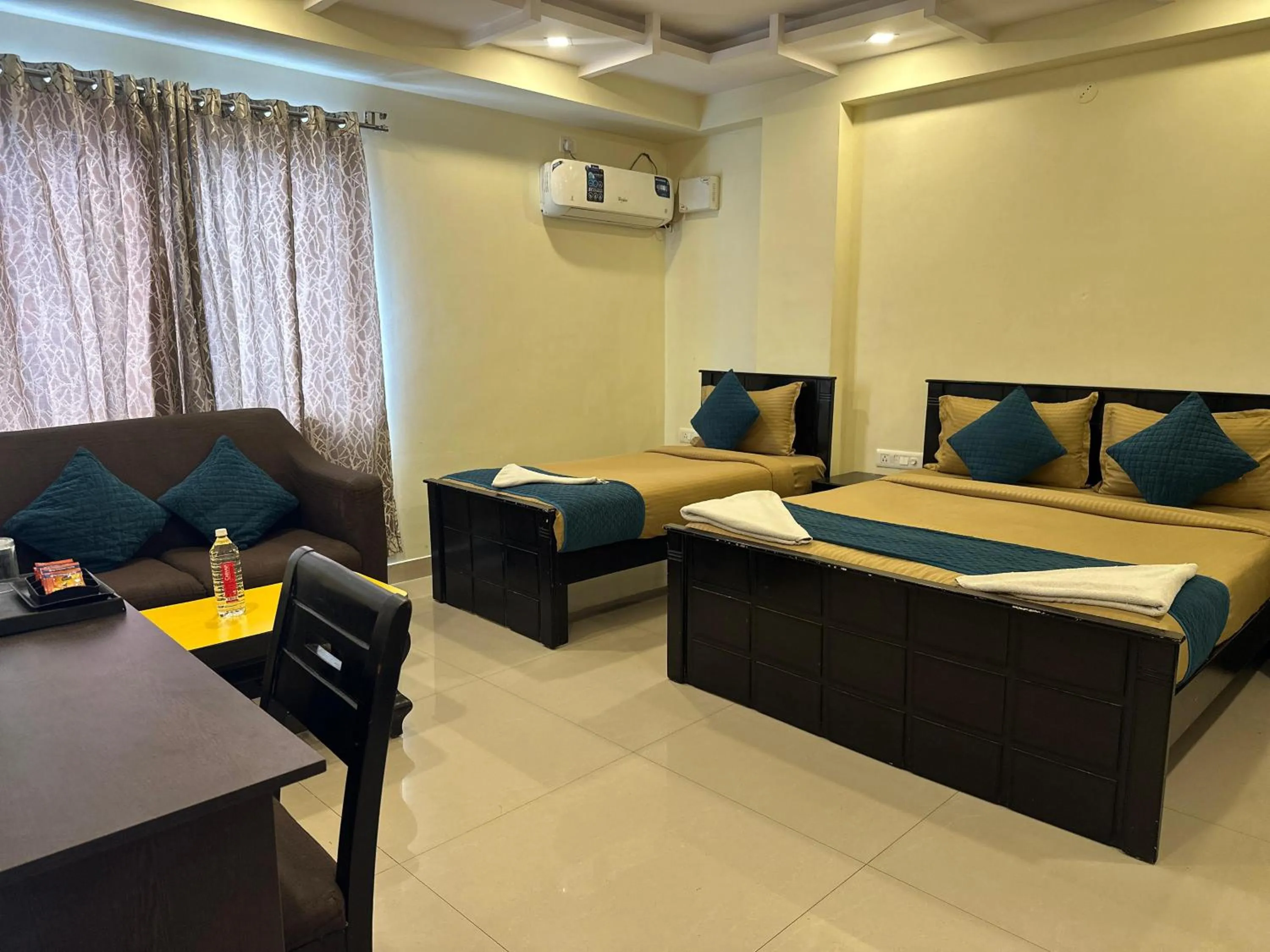 Bed in Blue Bliss Suites By PPH Living