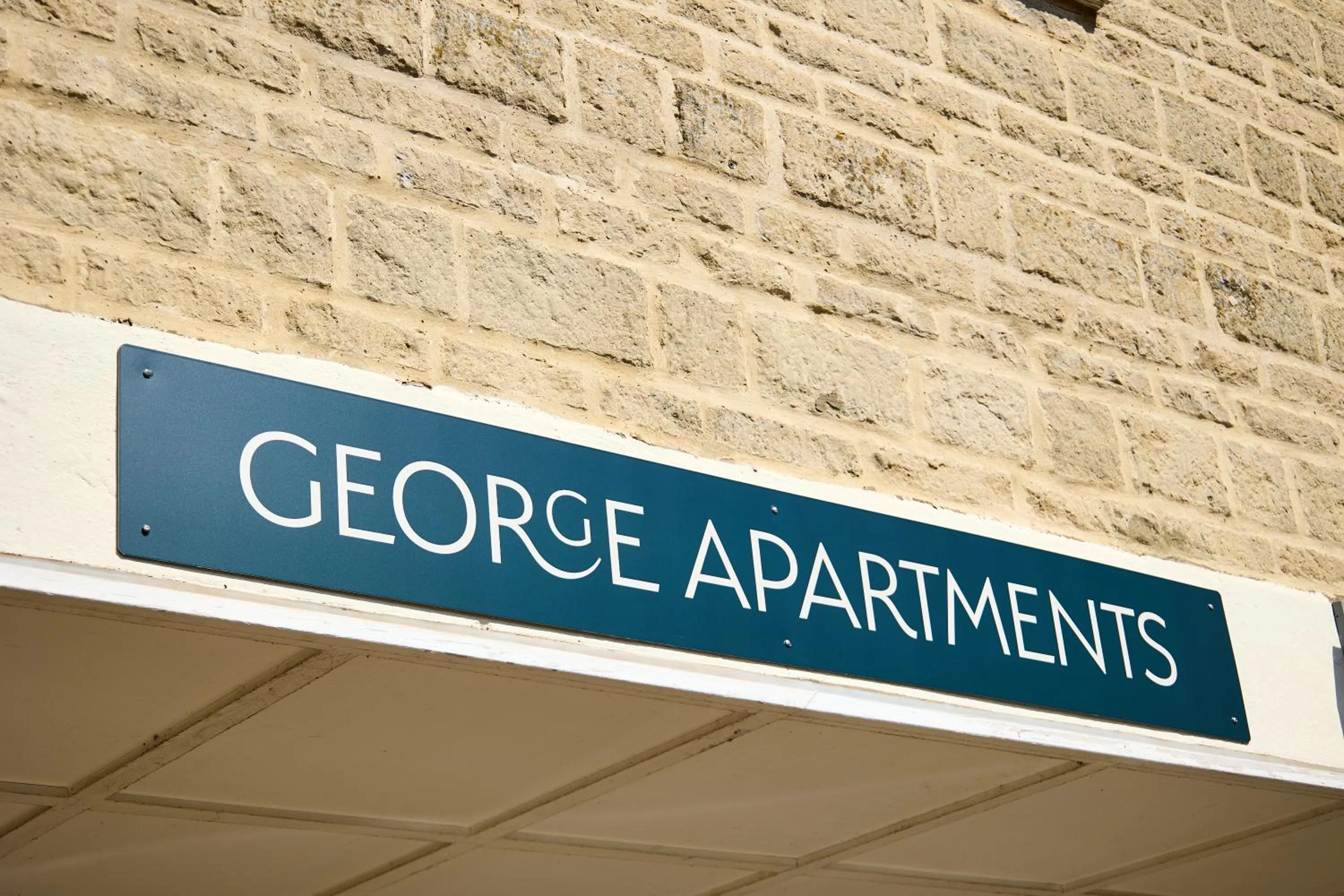 Property logo or sign in George Apartments