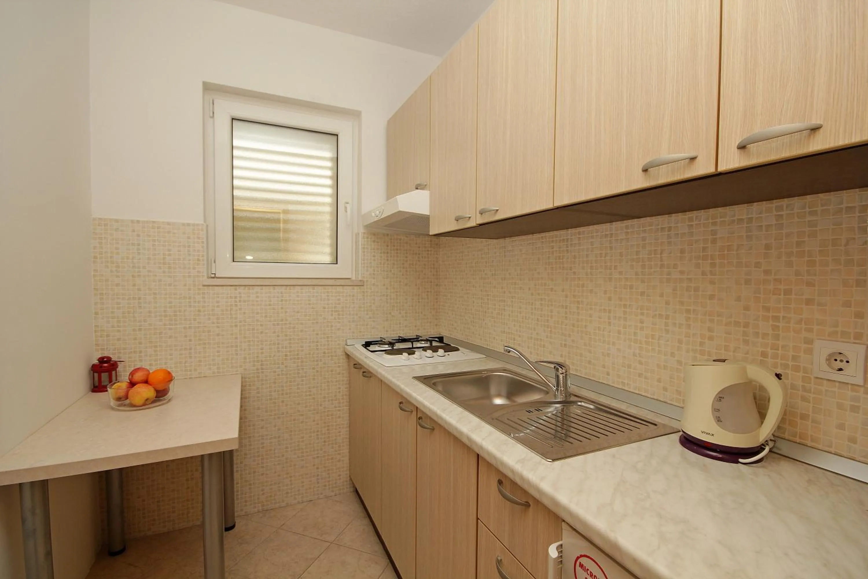 Kitchen or kitchenette in Apartments Adriatika