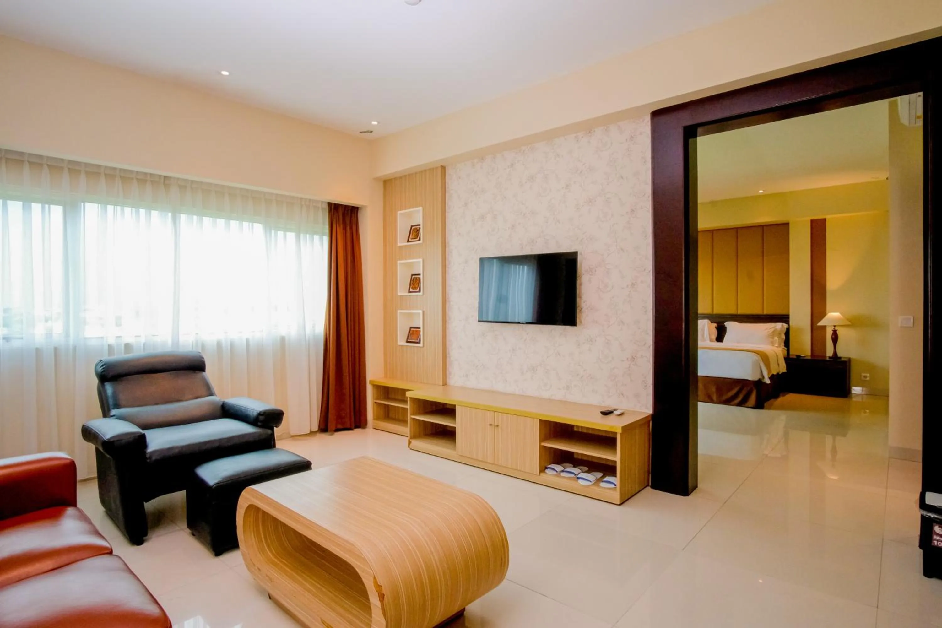 Living room, Bed in Istana Nelayan Hotel & Convention Powered by Archipelago