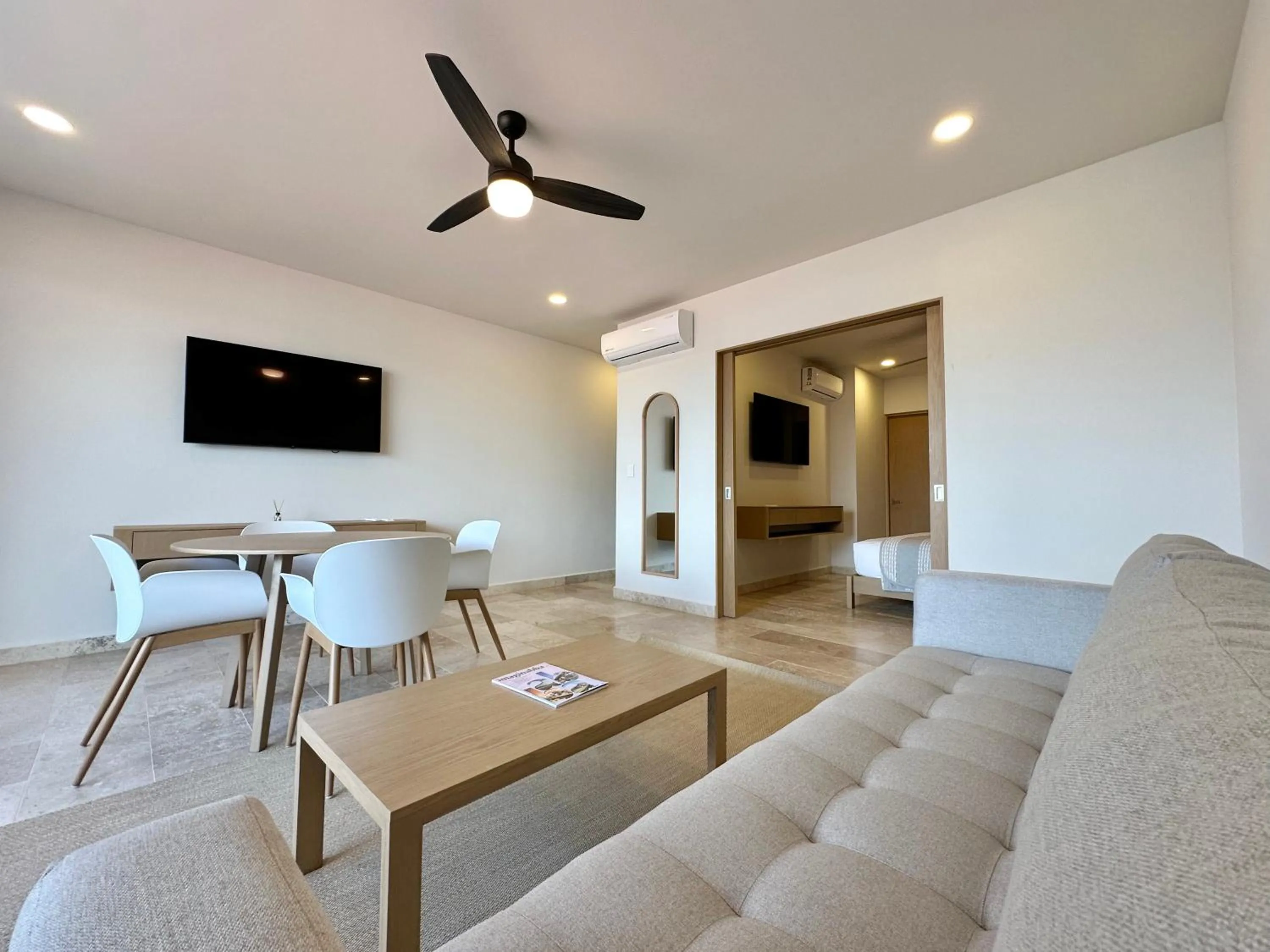 Communal lounge/ TV room in abba Suites Playa del Carmen