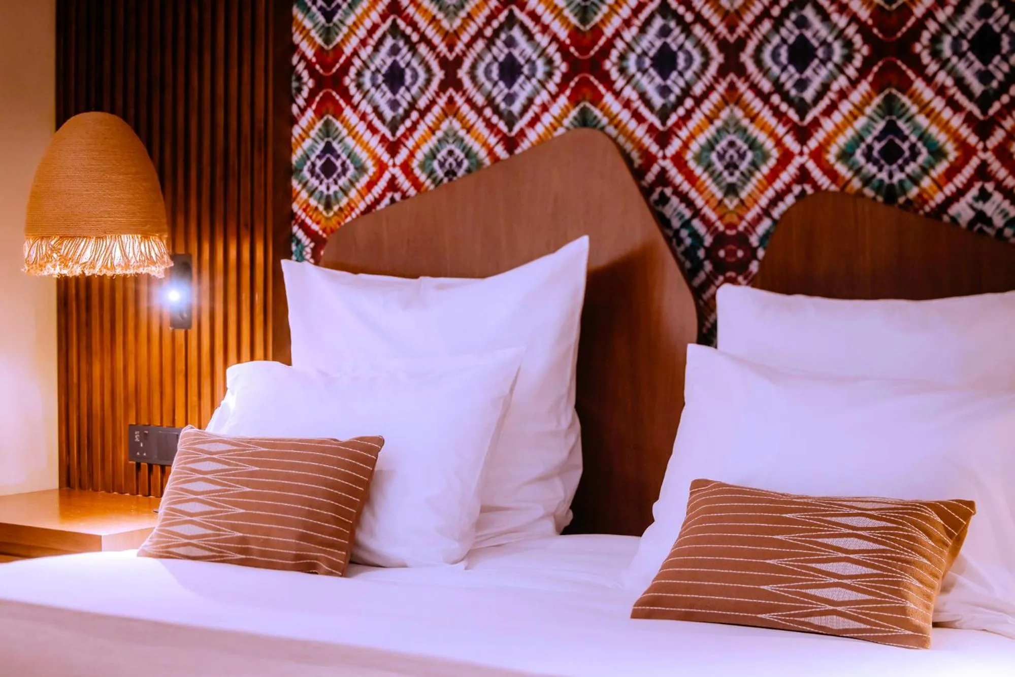 Bed in Onomo Allure Abuja AATC Hotel