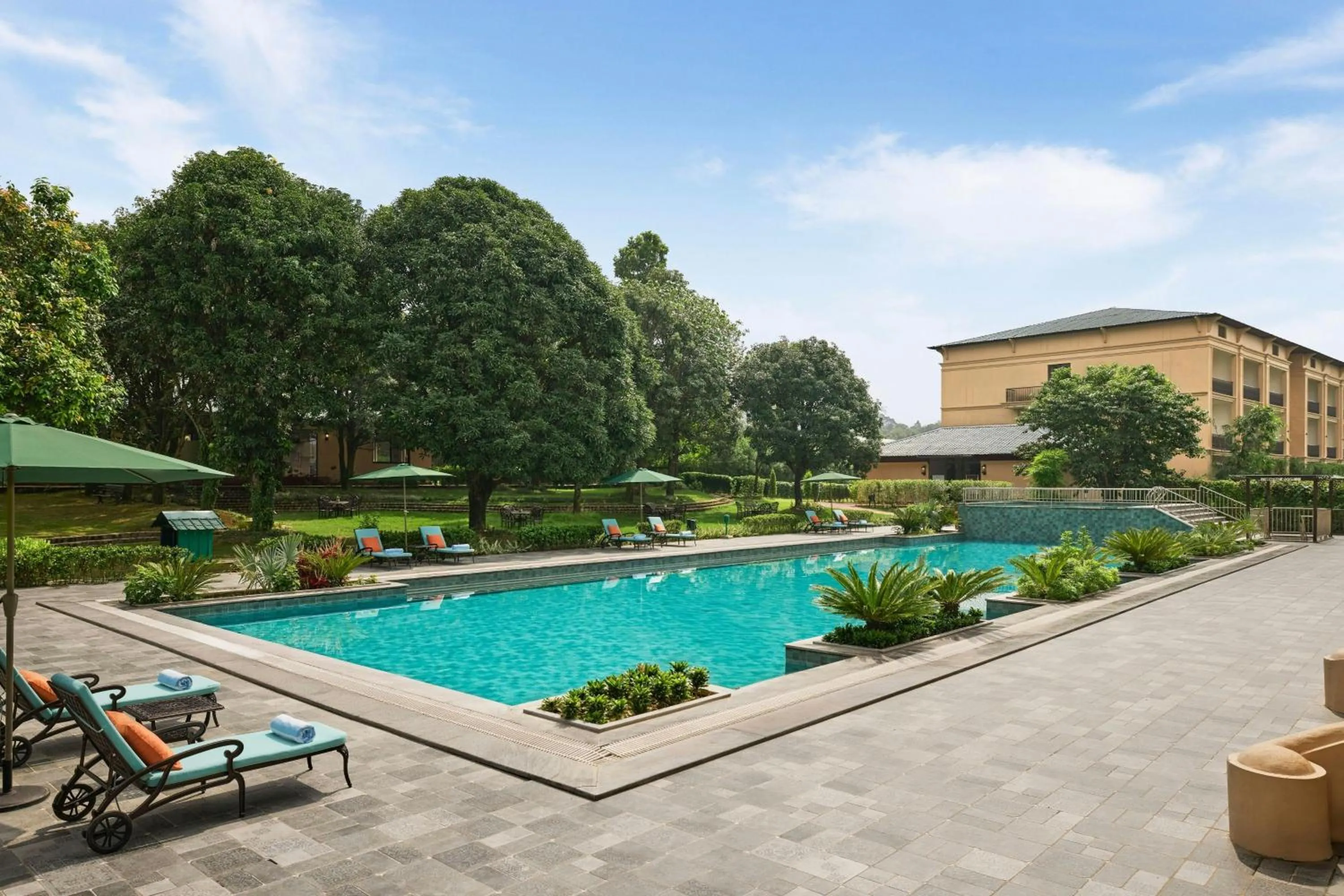 Swimming pool in Debu's The Fern Resort & Spa, Jim Corbett, Series by Marriott