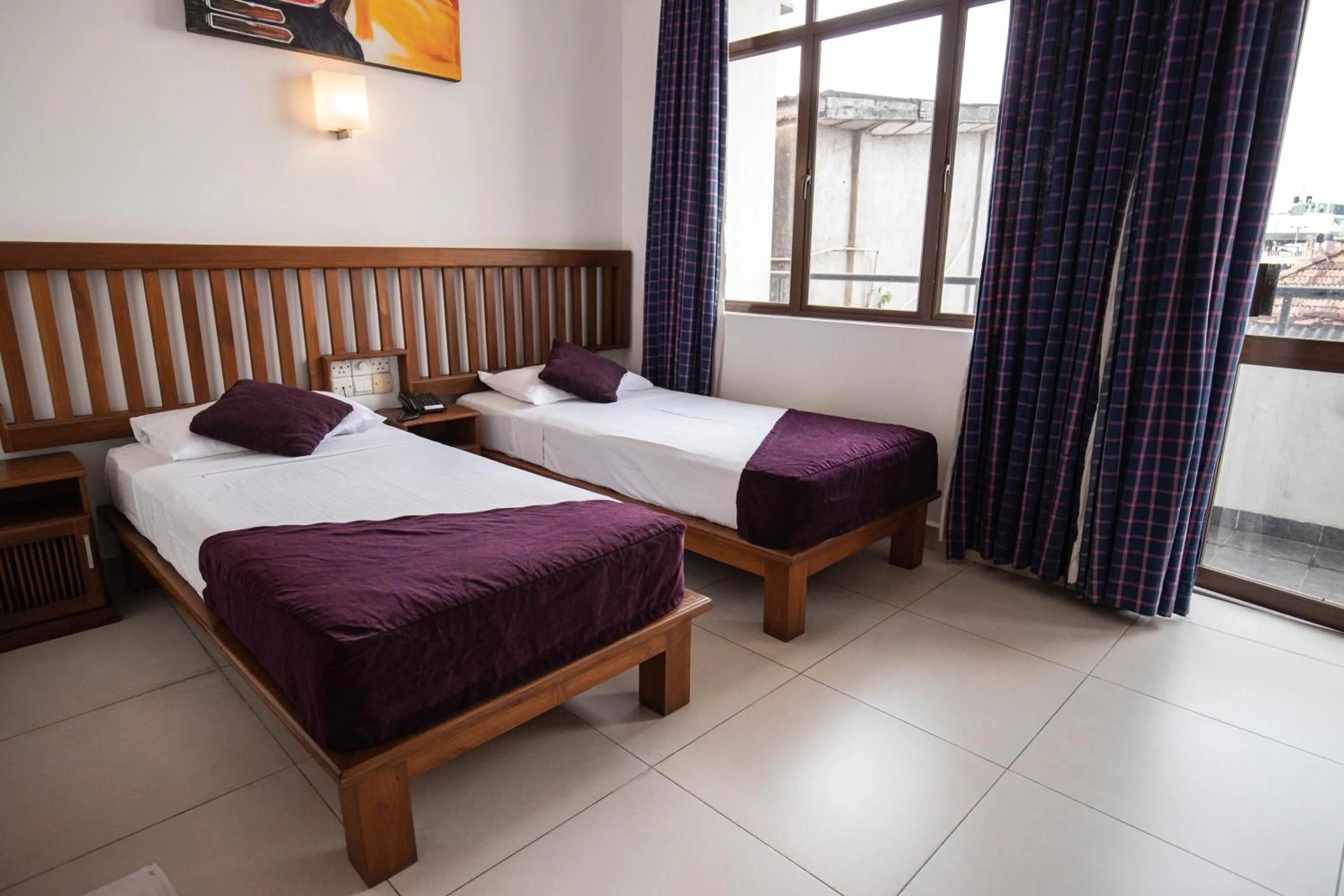 Bed in Port View City Hotel