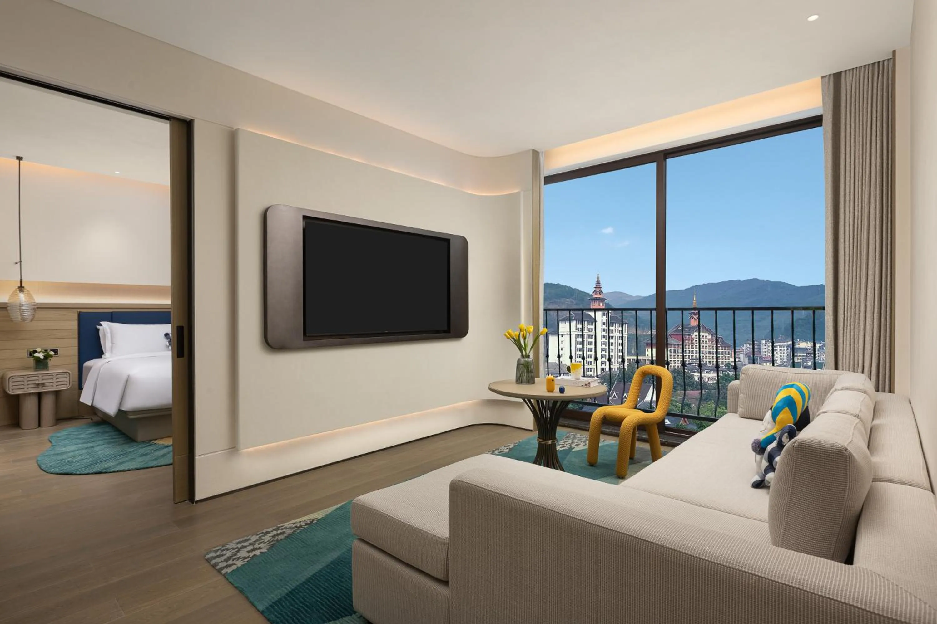 Living room in voco Xishuangbanna Gaozhuang by IHG