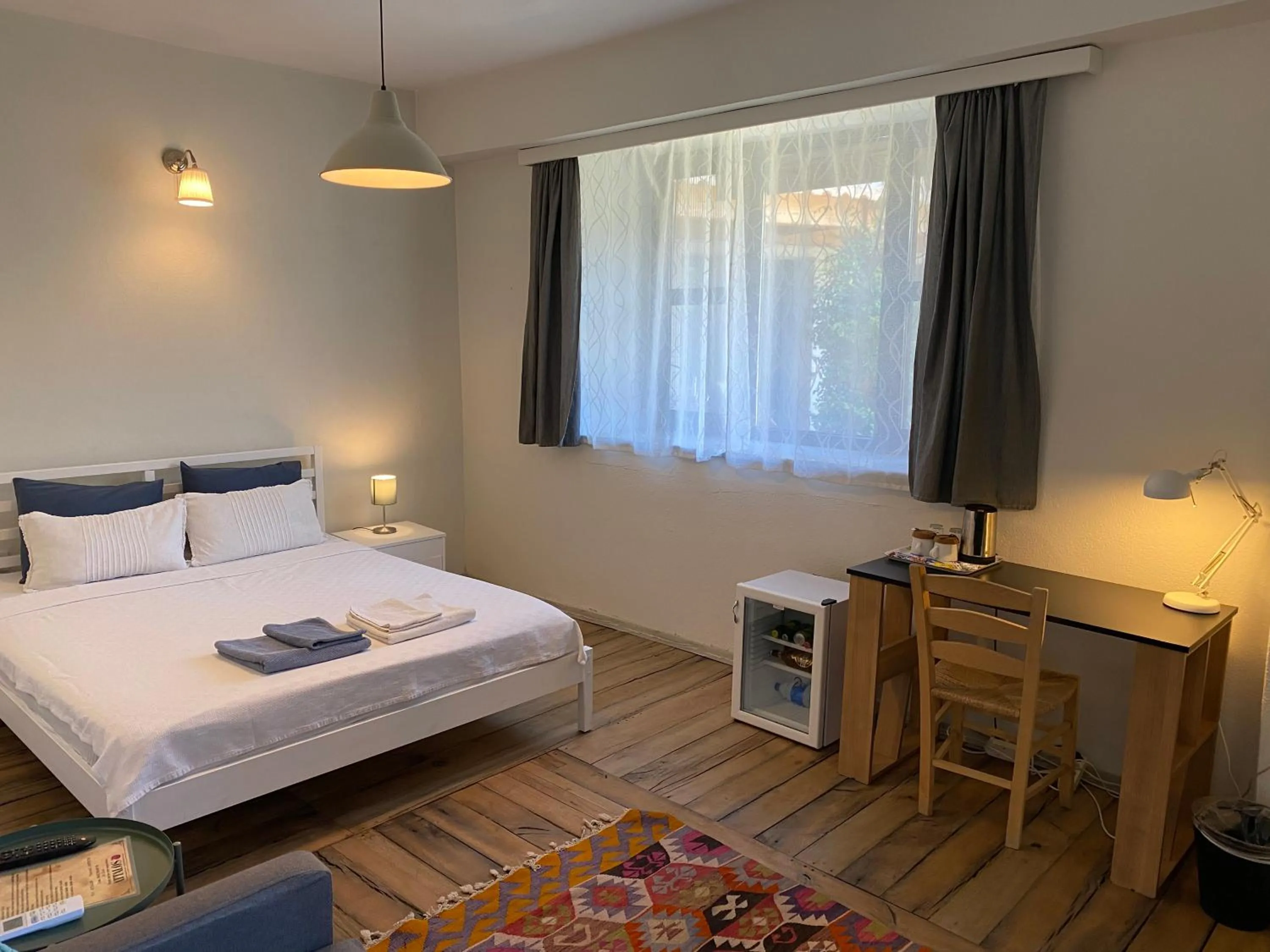 Bed in Attalos Suites Hotel