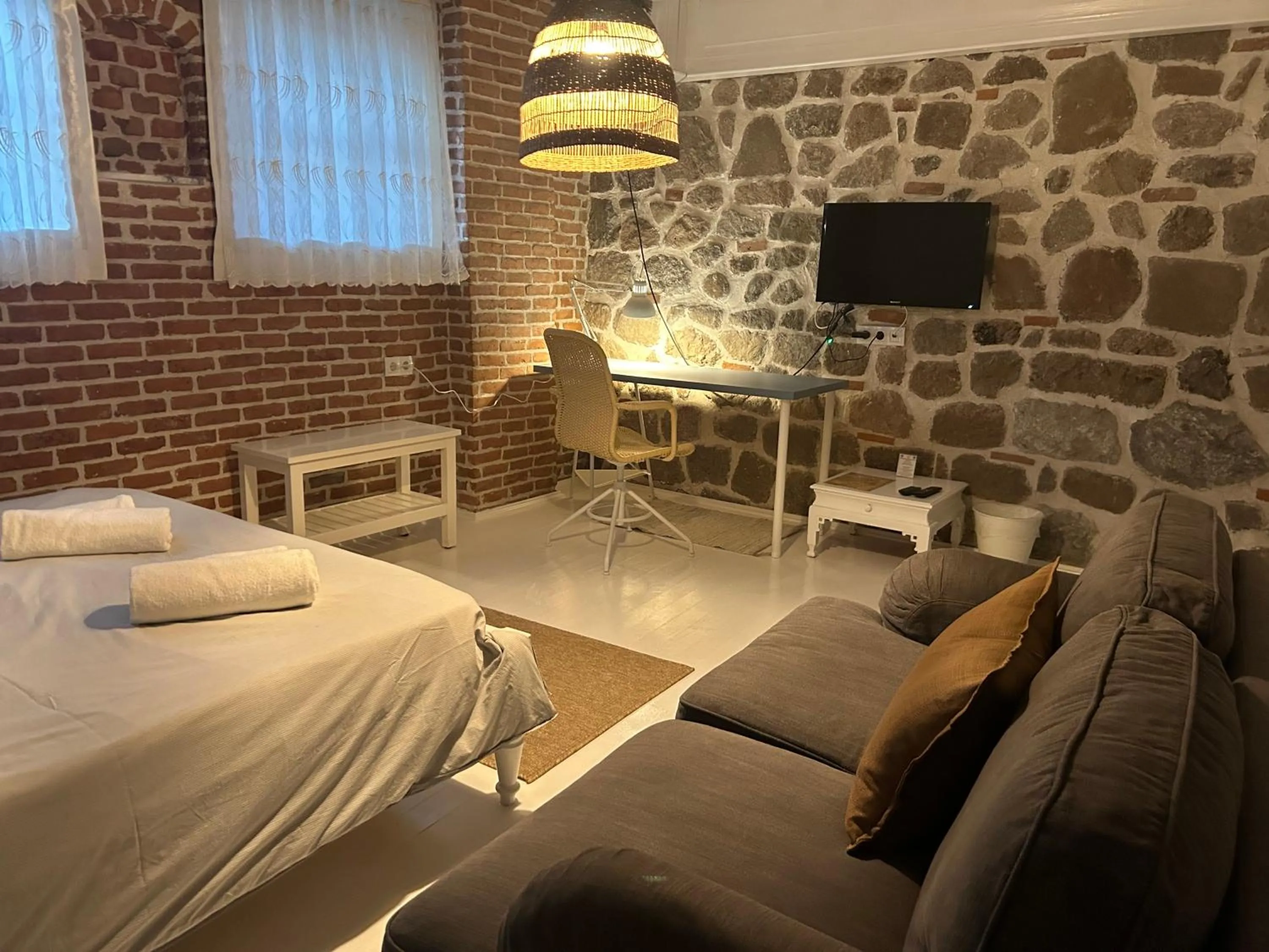 Bed in Attalos Suites Hotel