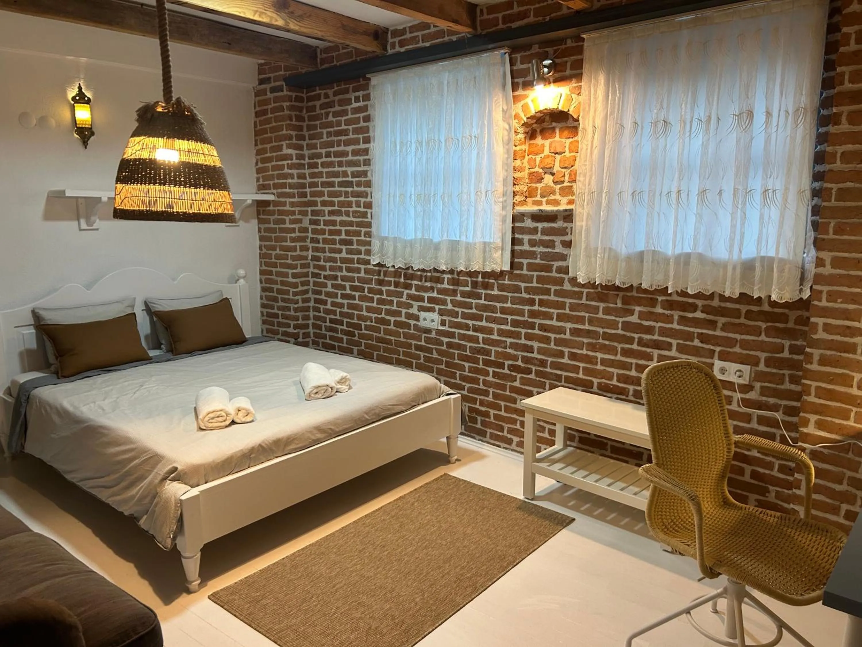 Bed in Attalos Suites Hotel