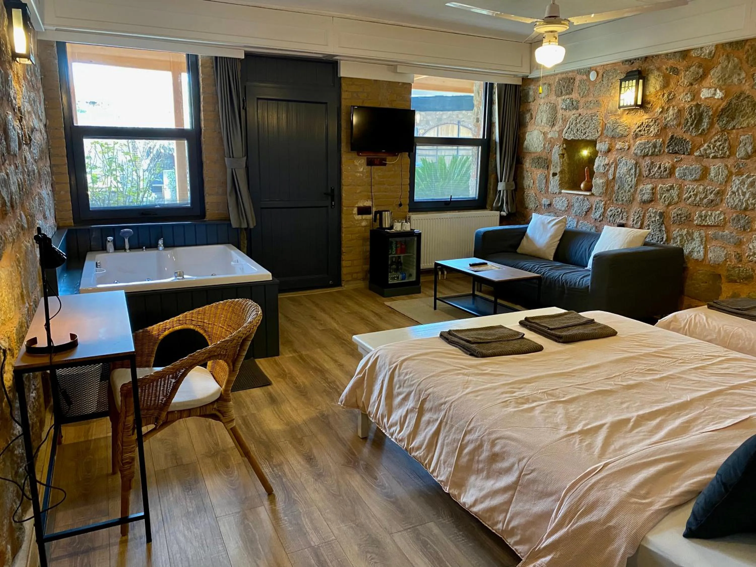 Bed in Attalos Suites Hotel