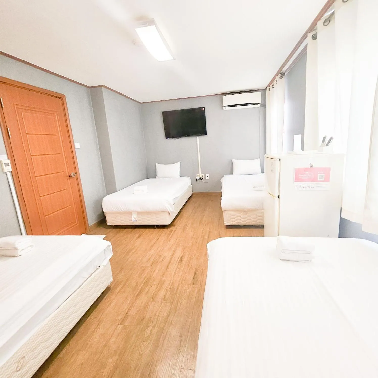 Bed in Jeju EQ Stay Hotel