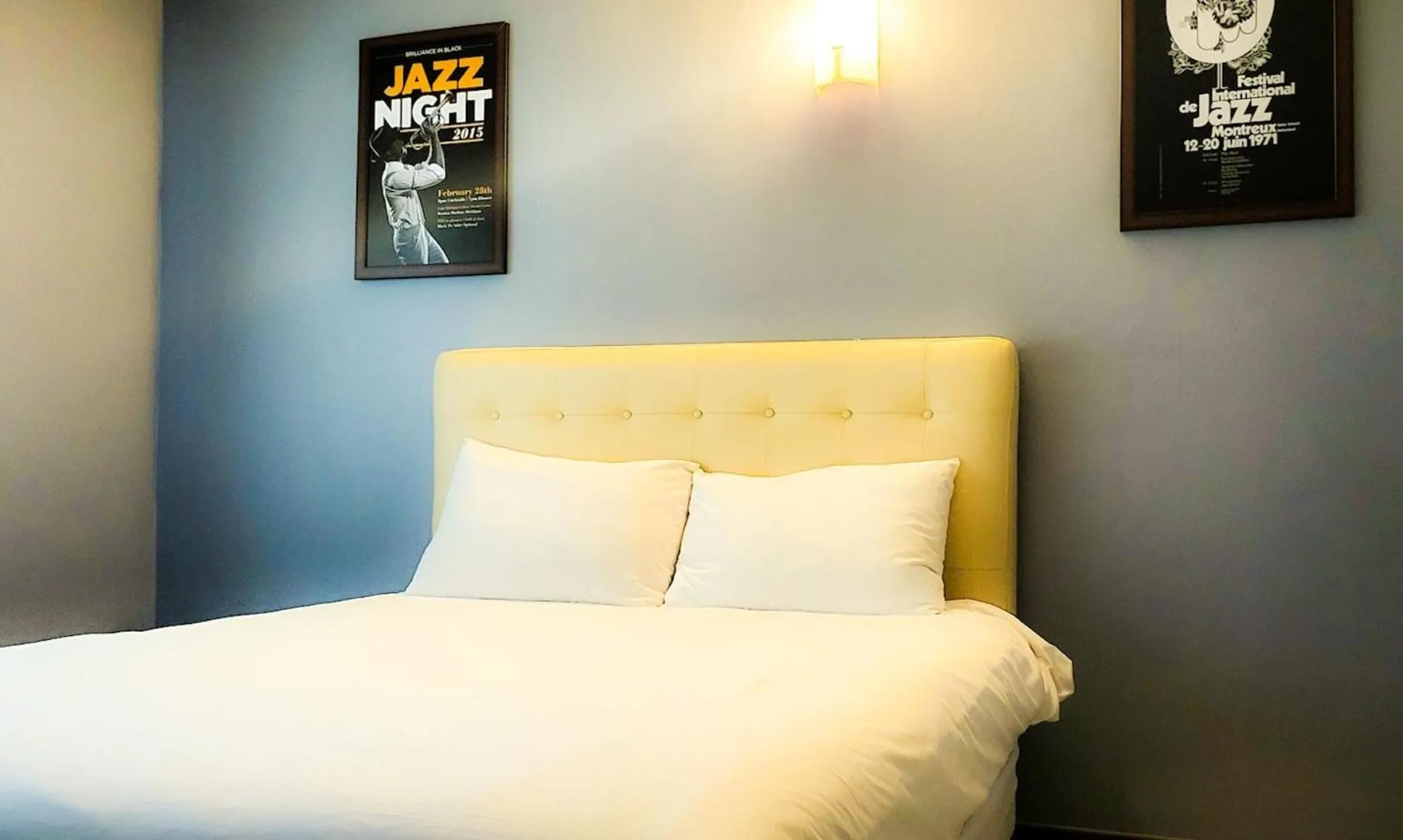 Bed in Jeju EQ Stay Hotel