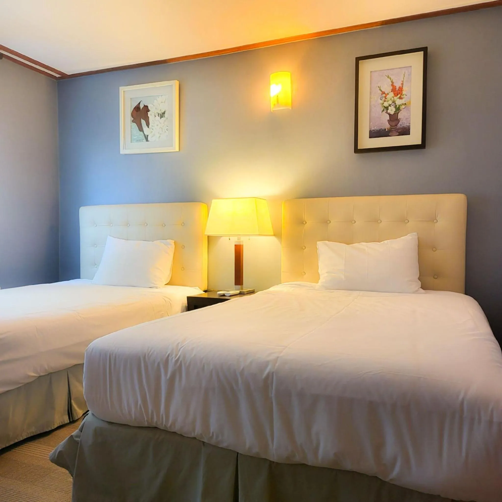 Bed in Jeju EQ Stay Hotel