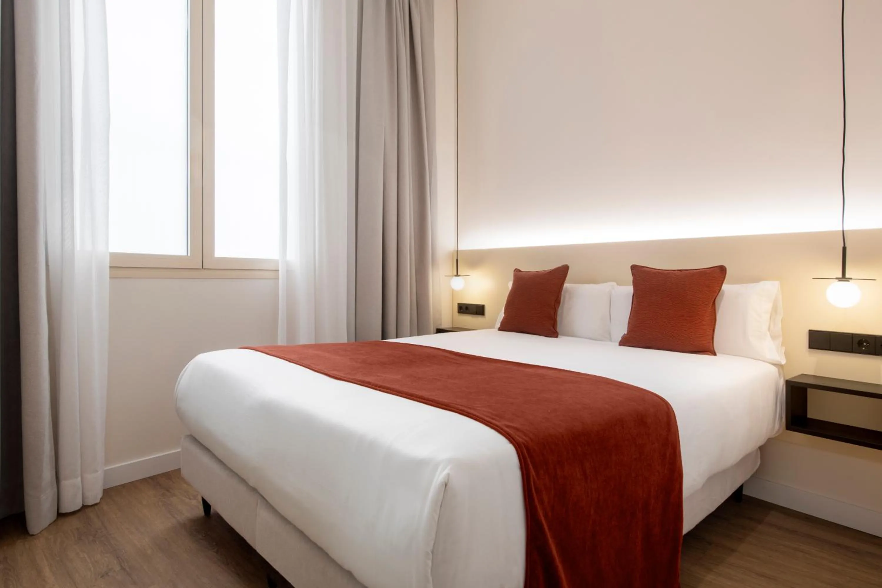 Bed in Magno Apartments Clavellinas