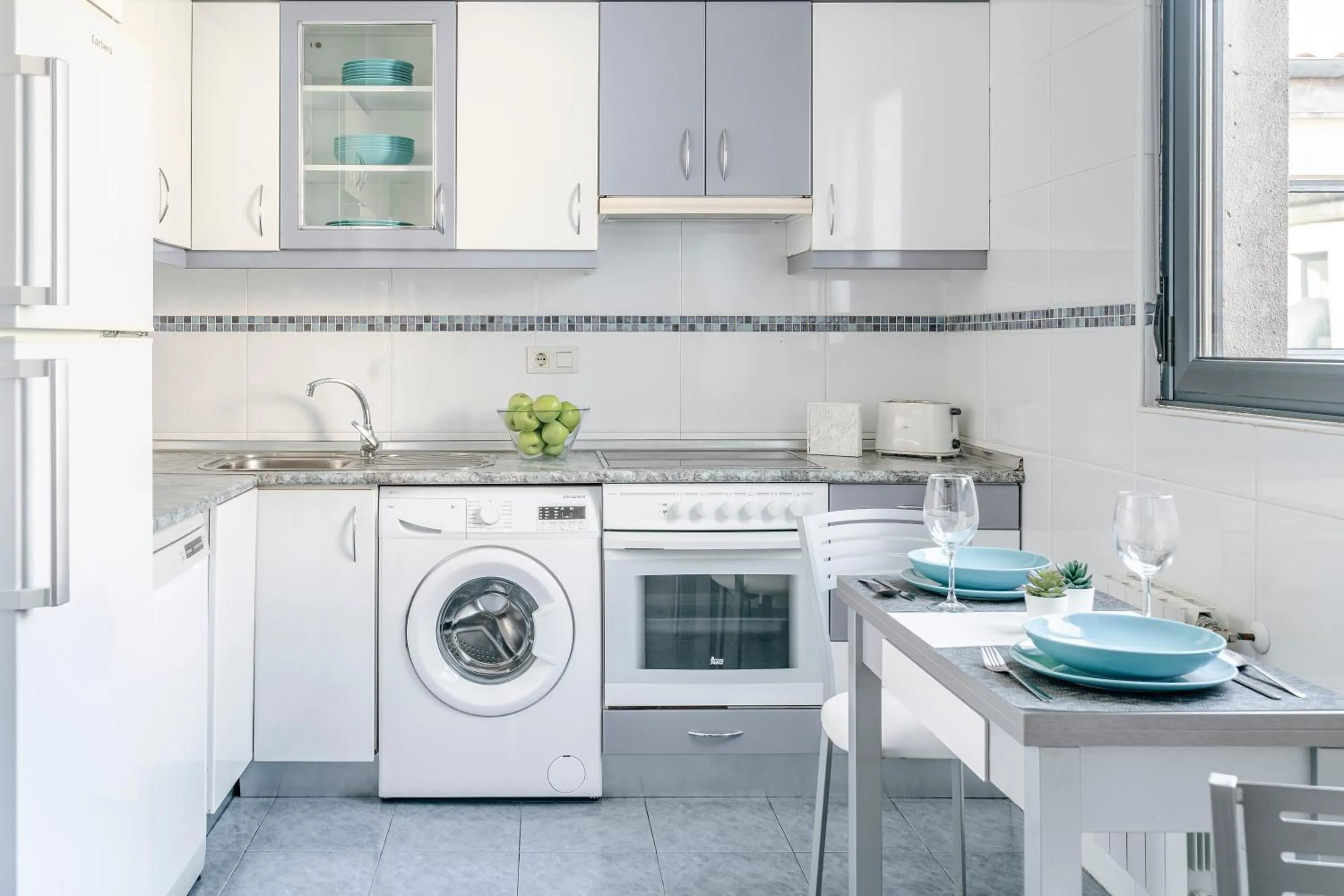 Kitchen or kitchenette in Apartamentos Alday