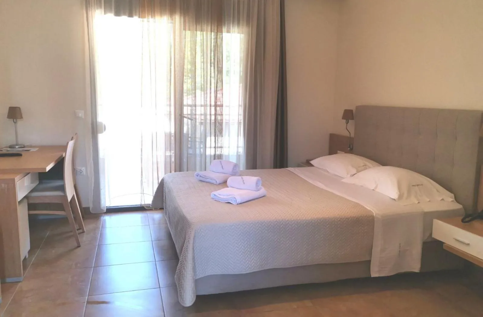 Photo of the whole room, Bed in Artemis Plaza