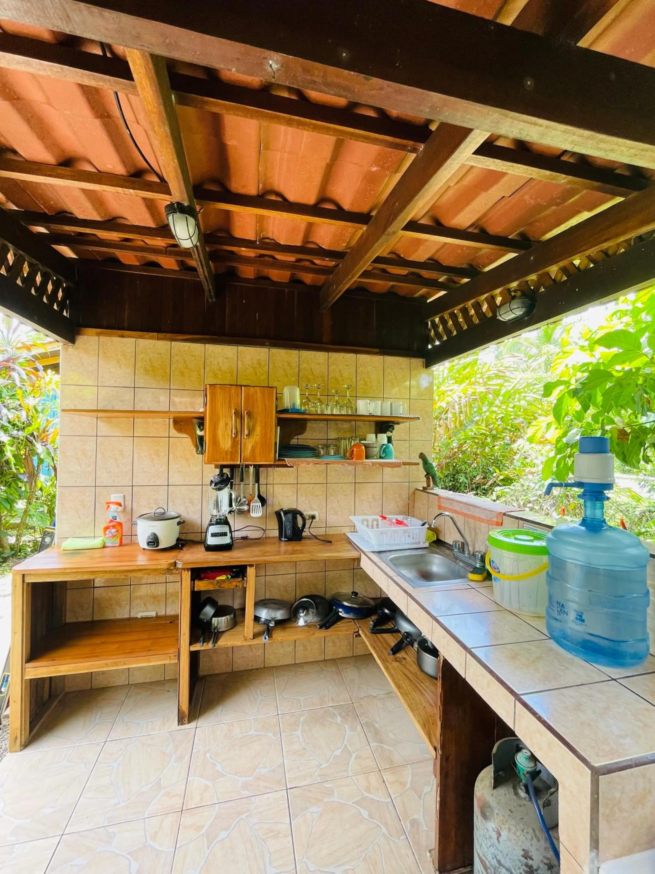 Communal kitchen in Pangea Lodge Tropical Vibe Home with Shared Pool