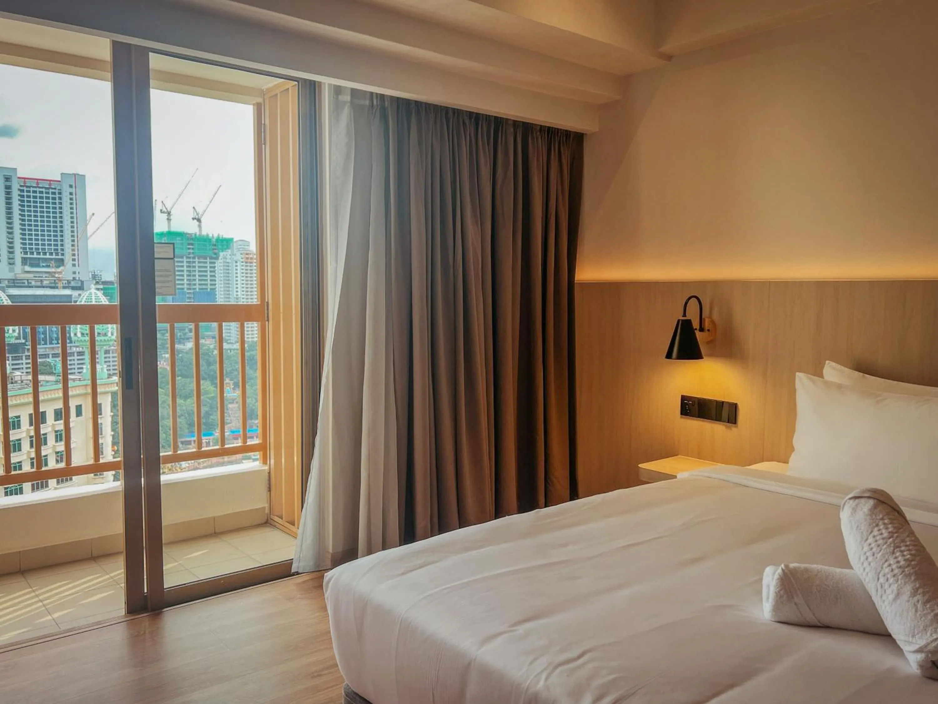 Balcony/Terrace, Bed in Resort Suites at Bandar Sunway