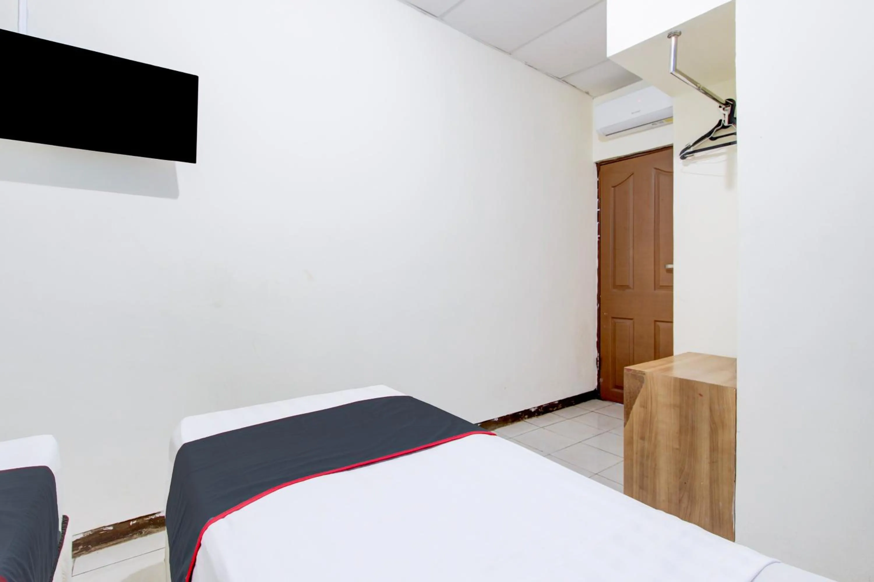 Bedroom in Hotel O Semarang near Kota Lama Semarang formerly Kamarkoe Residence