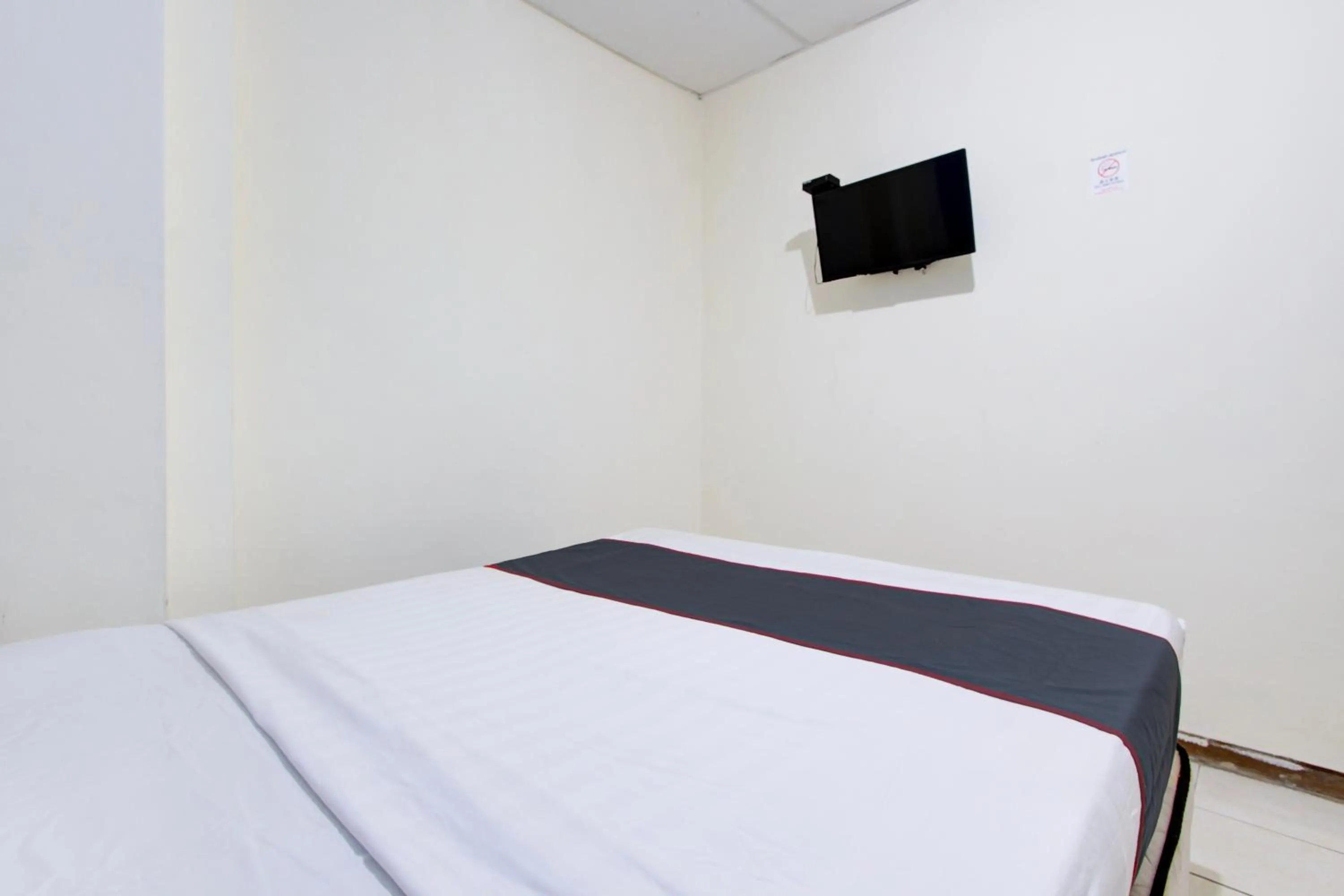 Bedroom in Hotel O Semarang near Kota Lama Semarang formerly Kamarkoe Residence