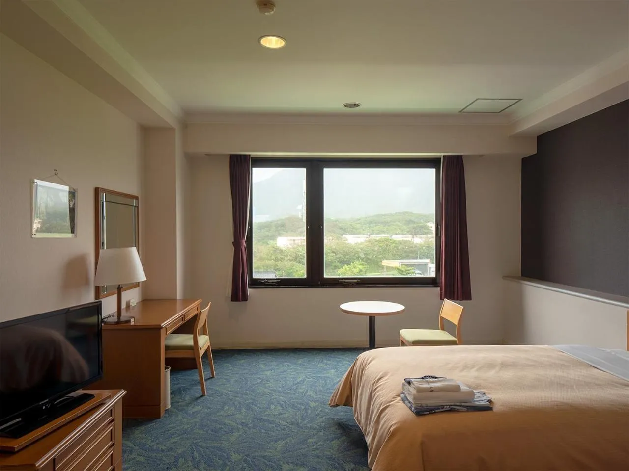 Bed in THE HOTEL YAKUSHIMA ocean & forest