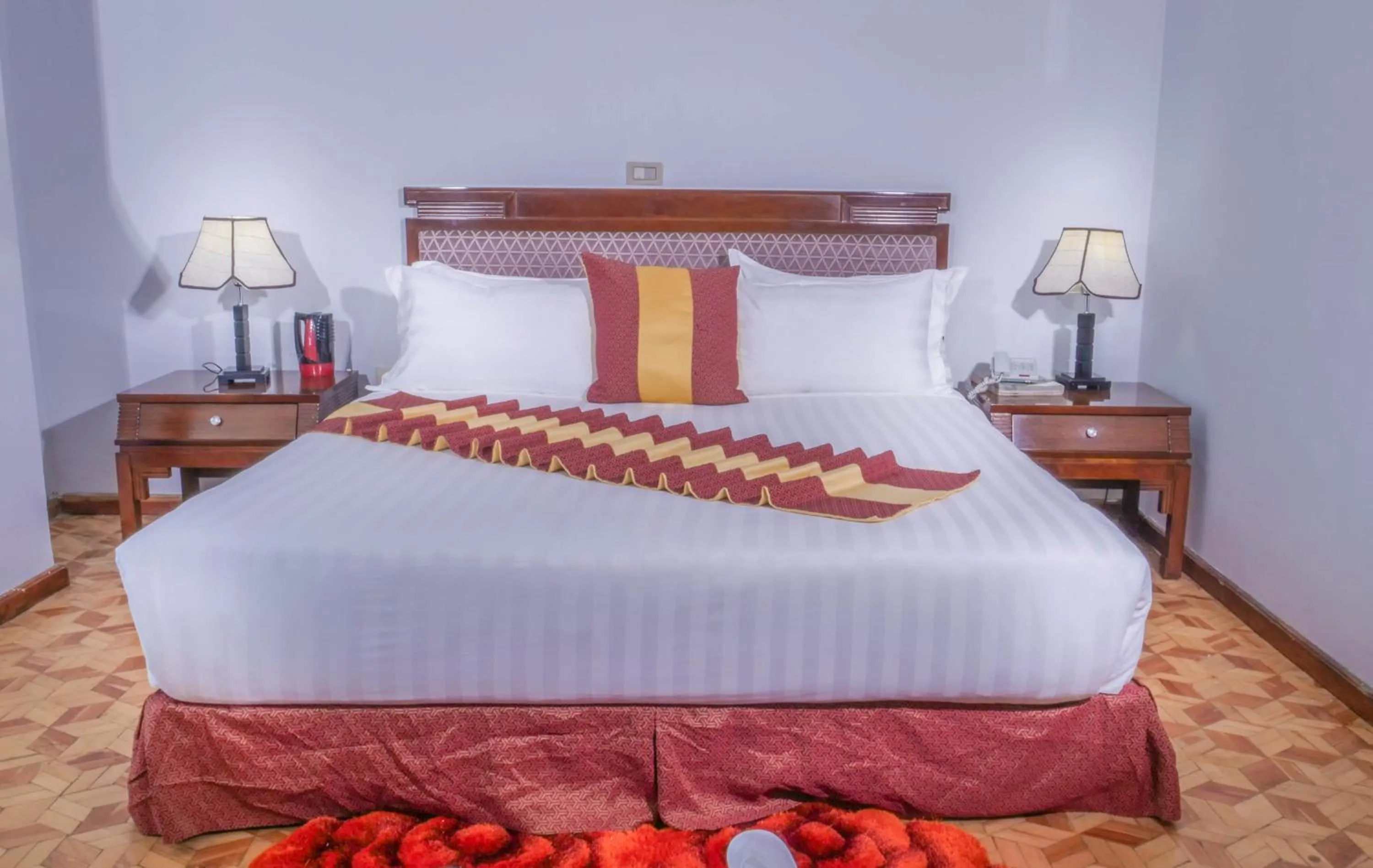 Bed in Tirar International Hotel