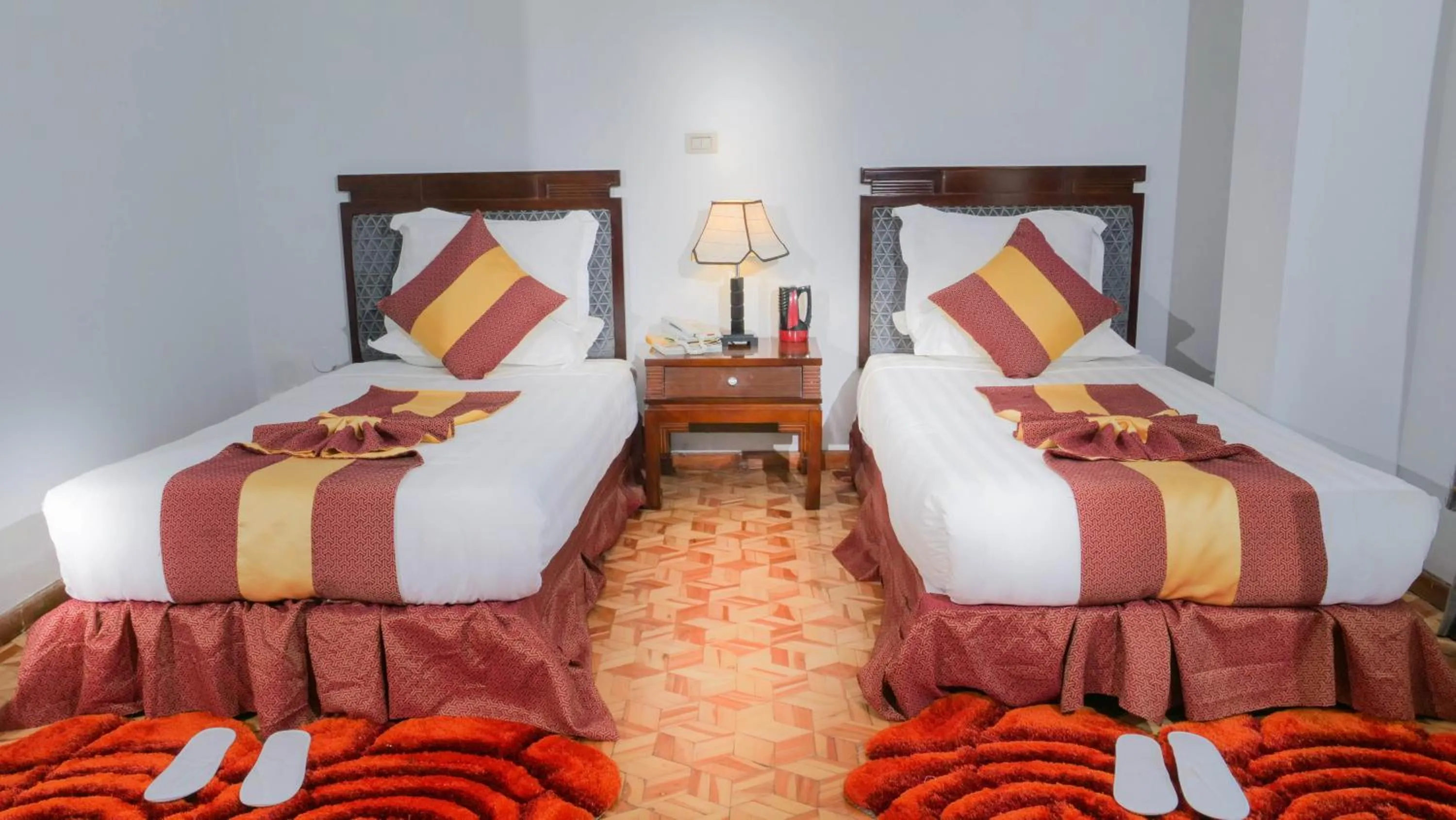 Bed in Tirar International Hotel