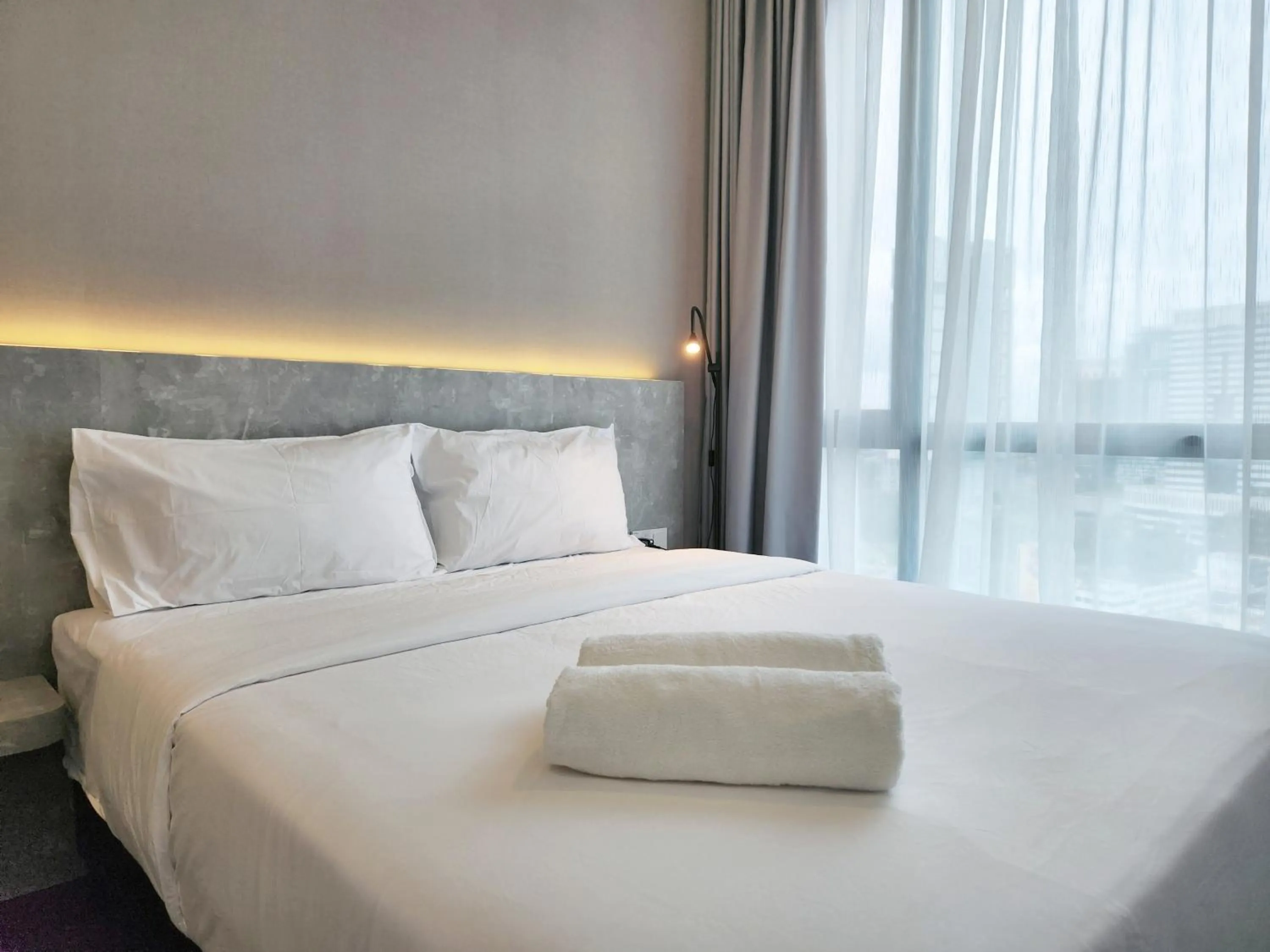 Bed in SKS Pavillion Suites