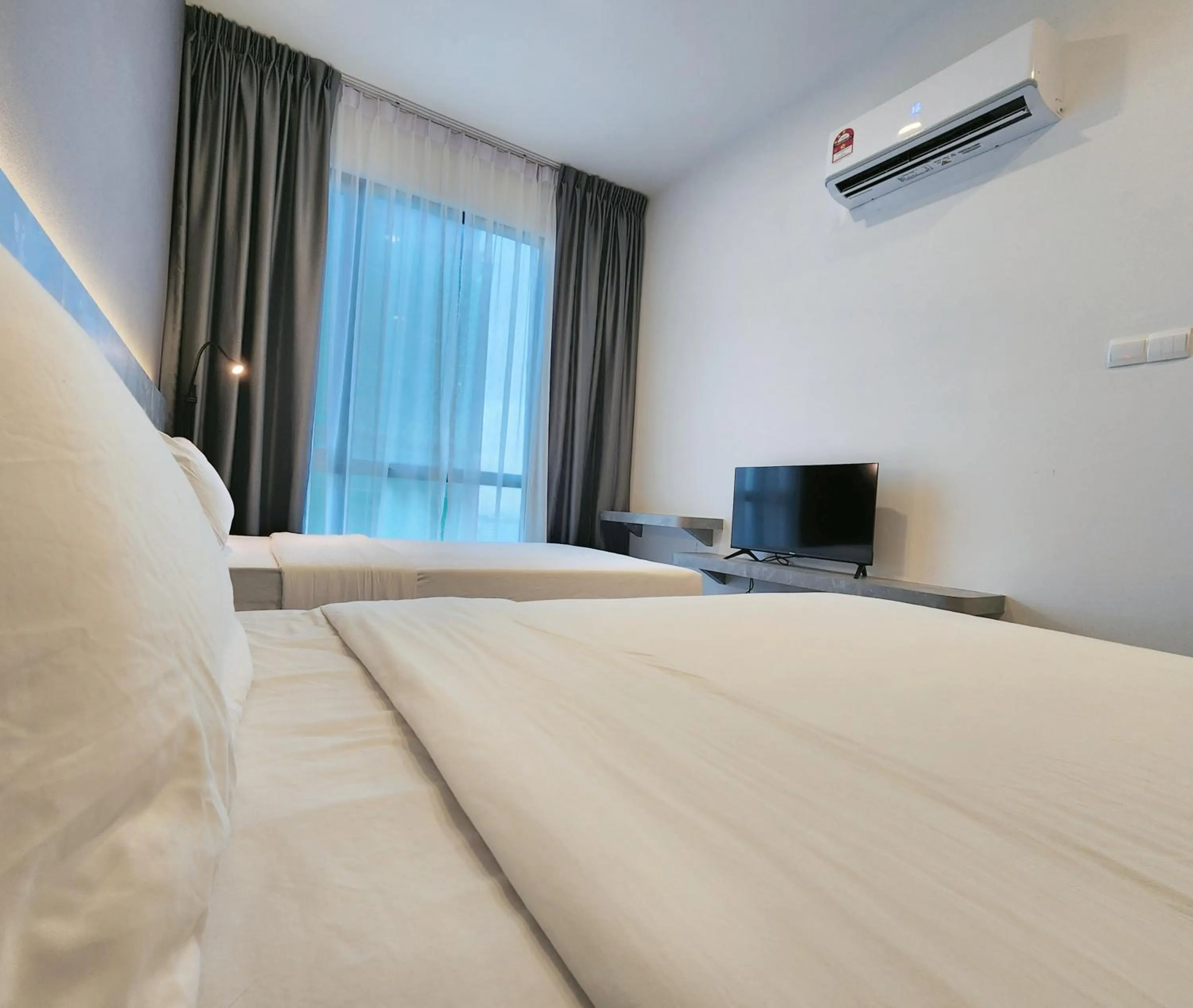 Bed in SKS Pavillion Suites