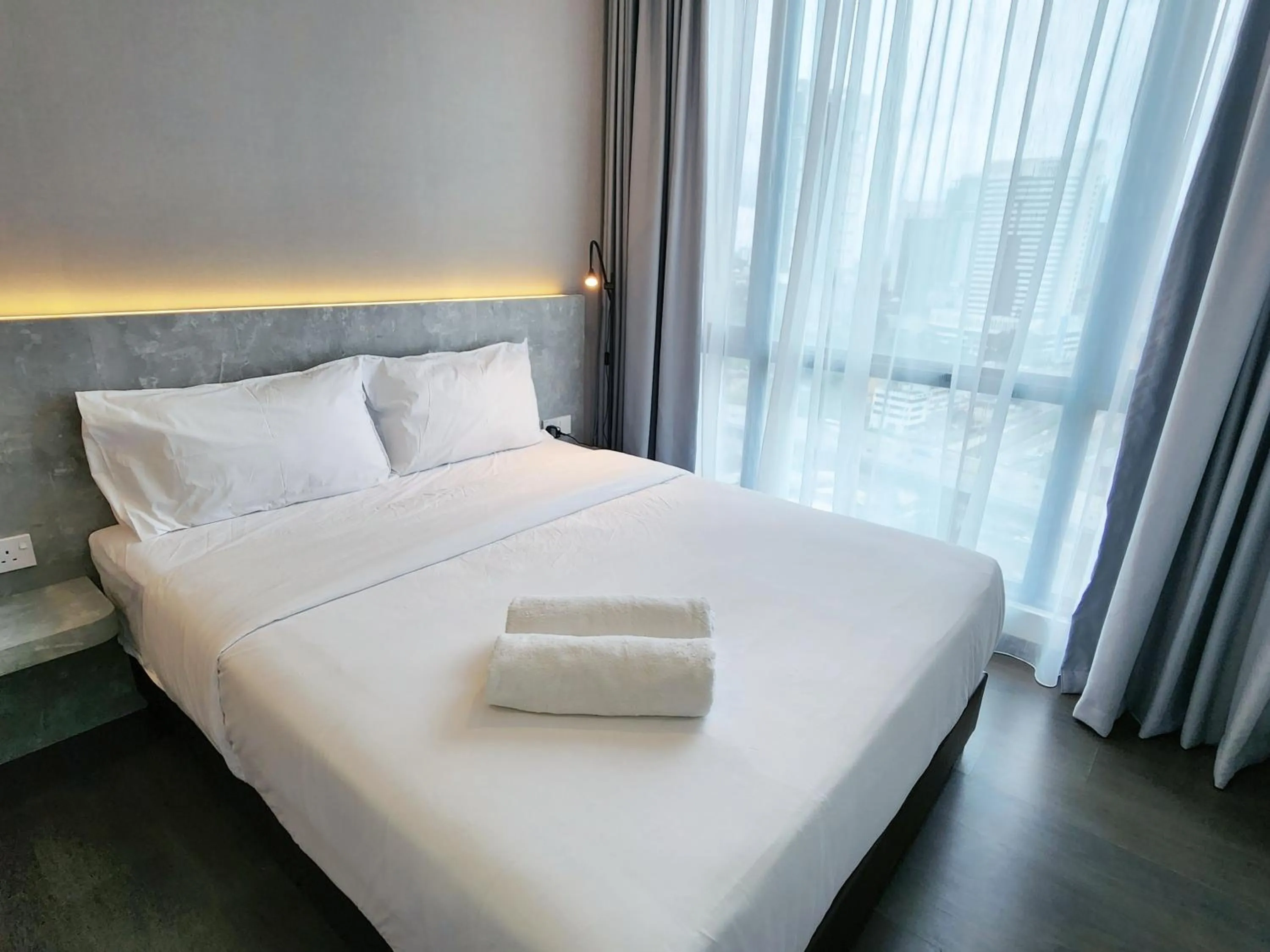 Bed in SKS Pavillion Suites