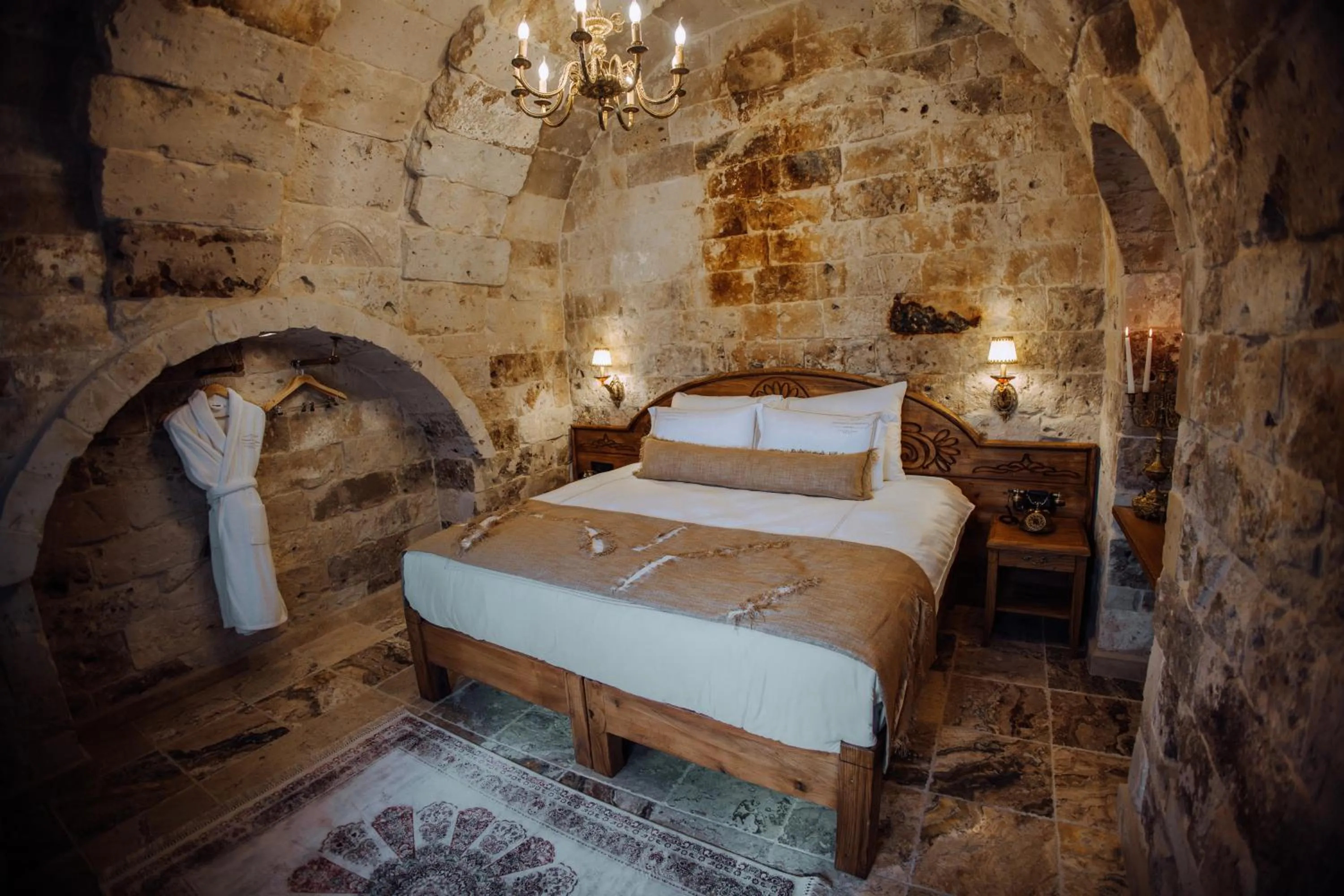 Bed in The Kingdom Of Cappadocia Luxury Cave Hotel