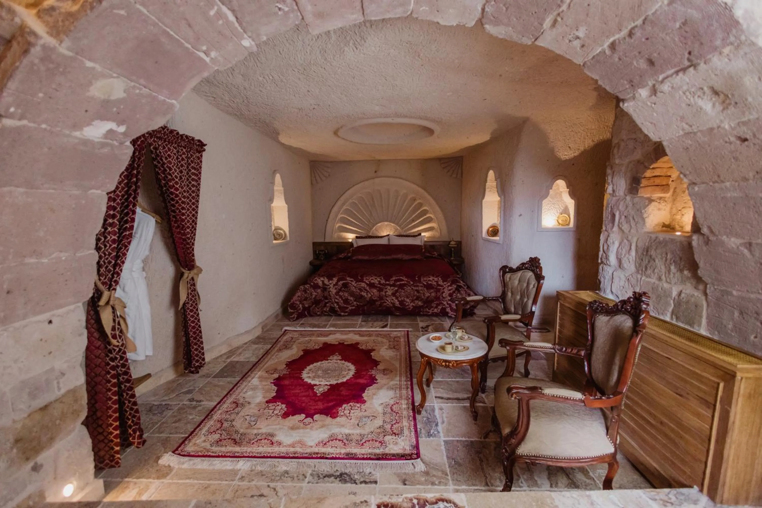 Seating area, Bed in The Kingdom Of Cappadocia Luxury Cave Hotel