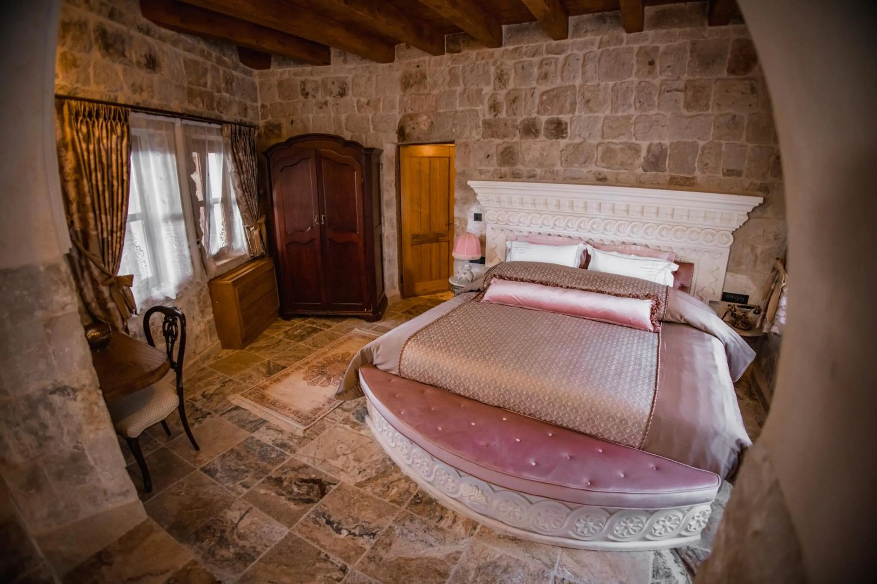 Bed in The Kingdom Of Cappadocia Luxury Cave Hotel