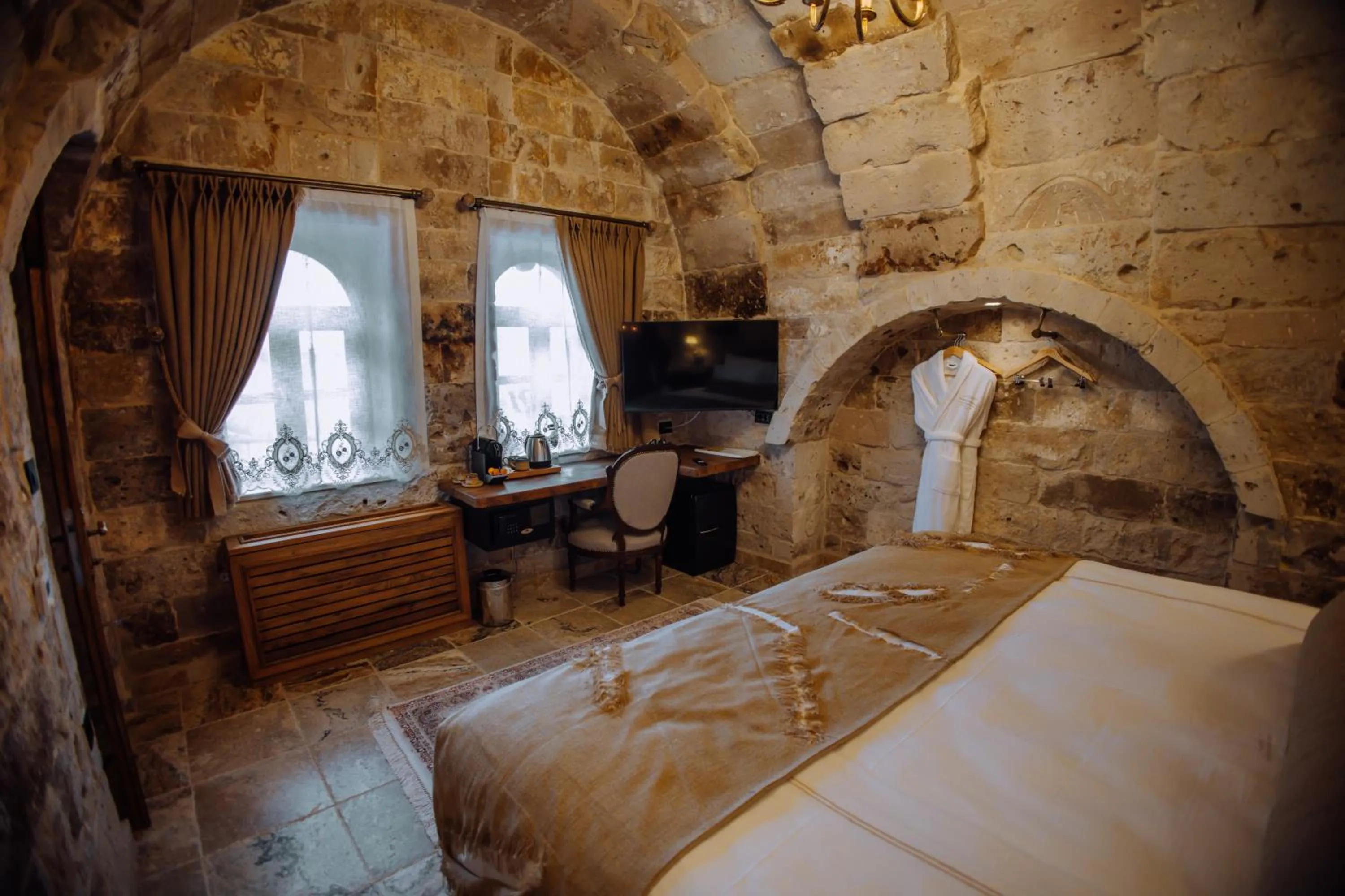 Bed in The Kingdom Of Cappadocia Luxury Cave Hotel