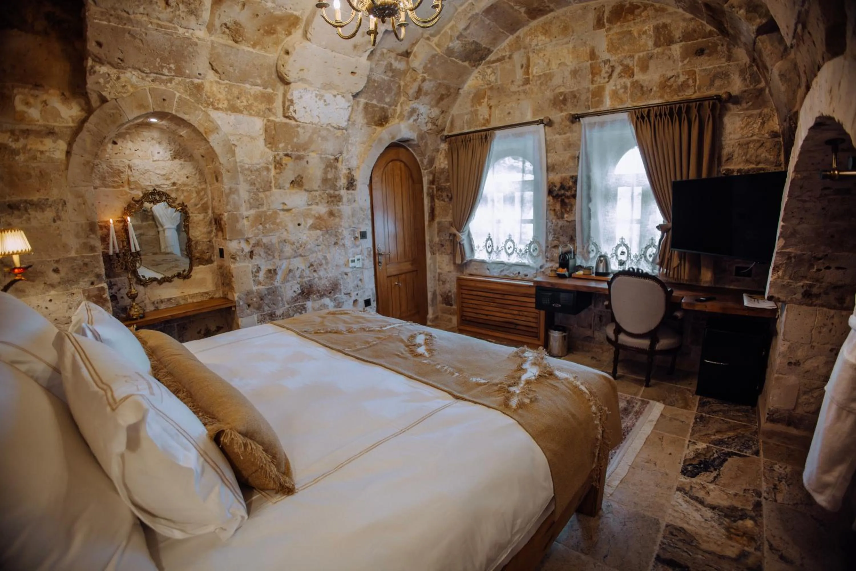 Bed in The Kingdom Of Cappadocia Luxury Cave Hotel