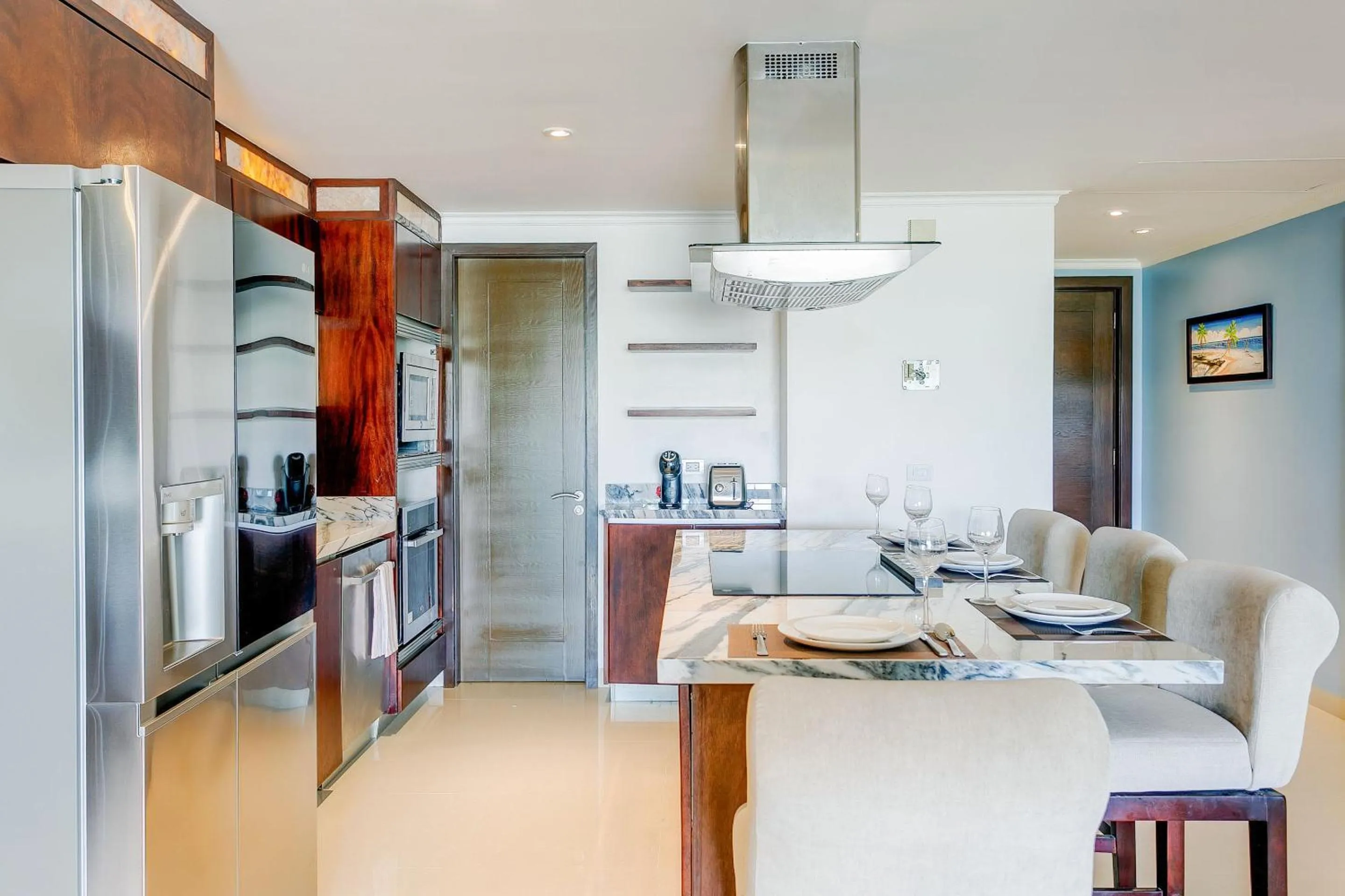 Kitchen or kitchenette in Luxury Condos at Mareazul Beachfront Complex with Resort-Style Amenities