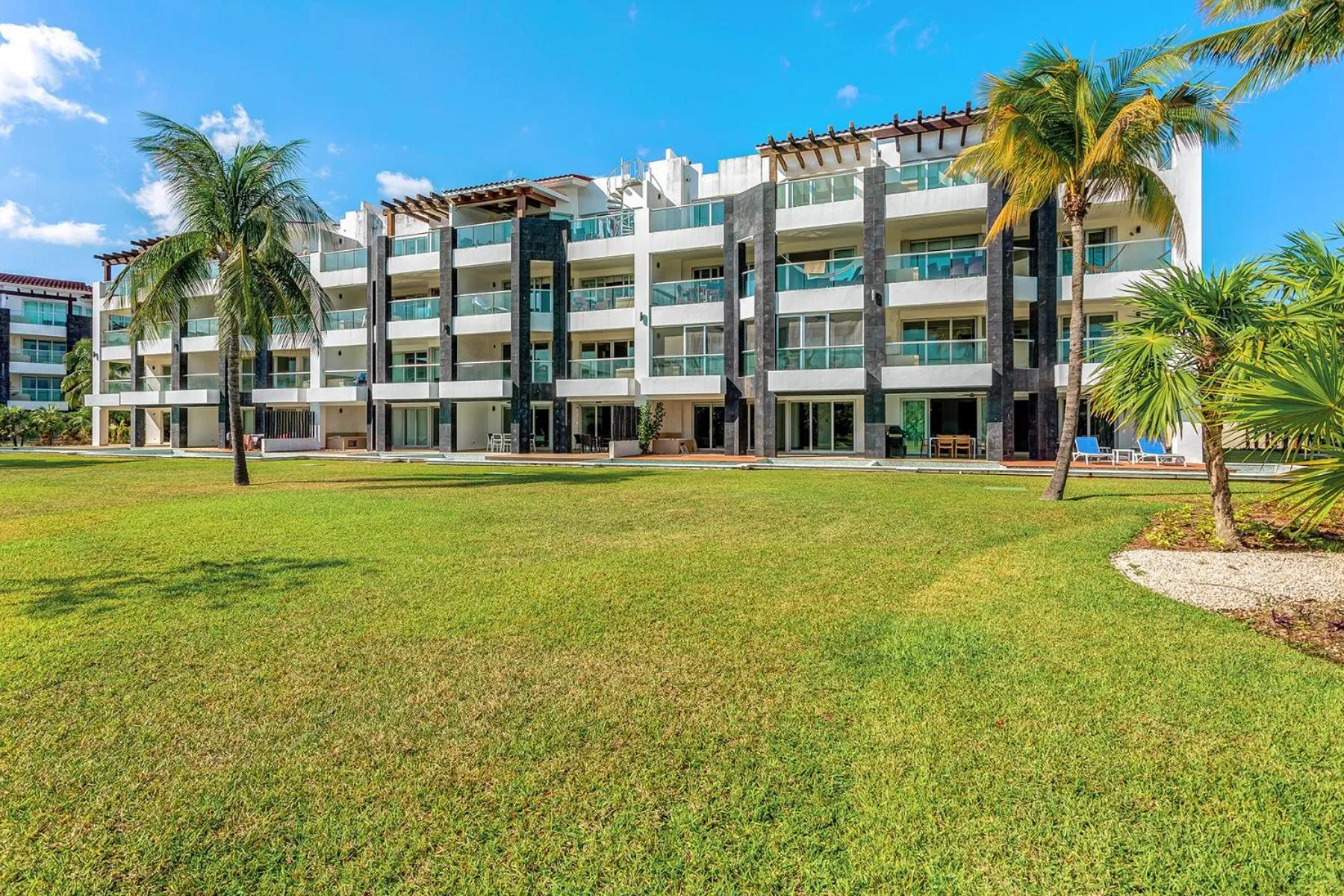 Property building in Luxury Condos at Mareazul Beachfront Complex with Resort-Style Amenities
