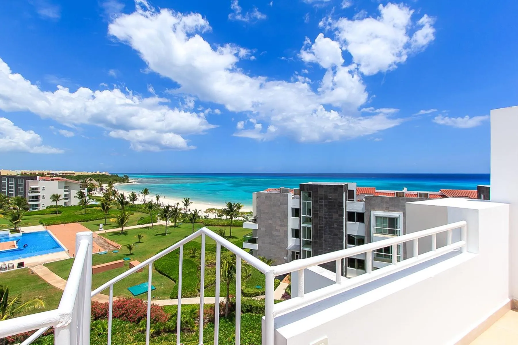 Property building in Luxury Condos at Mareazul Beachfront Complex with Resort-Style Amenities