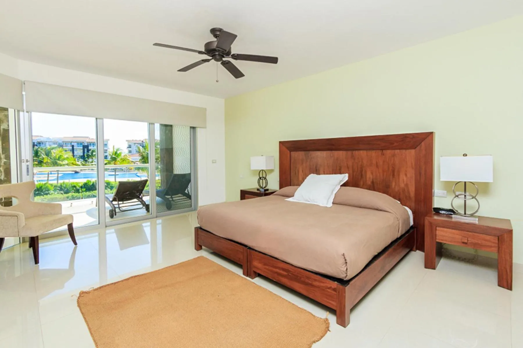 Bed in Luxury Condos at Mareazul Beachfront Complex with Resort-Style Amenities