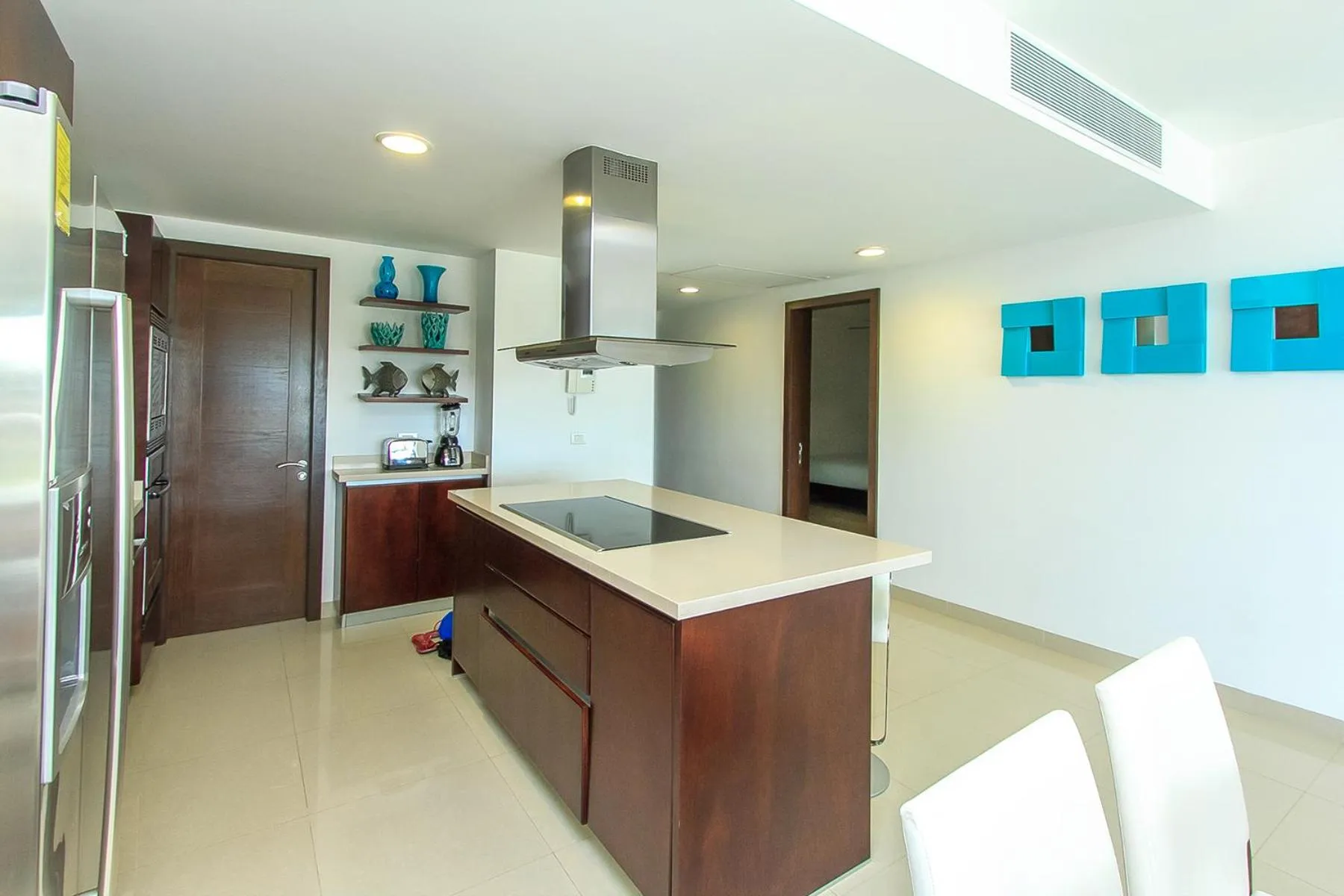 Kitchen or kitchenette in Luxury Condos at Mareazul Beachfront Complex with Resort-Style Amenities