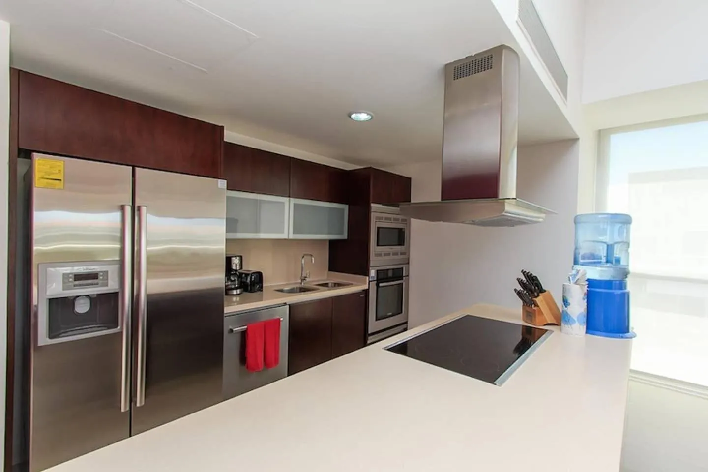 kitchen in Luxury Condos at Mareazul Beachfront Complex with Resort-Style Amenities