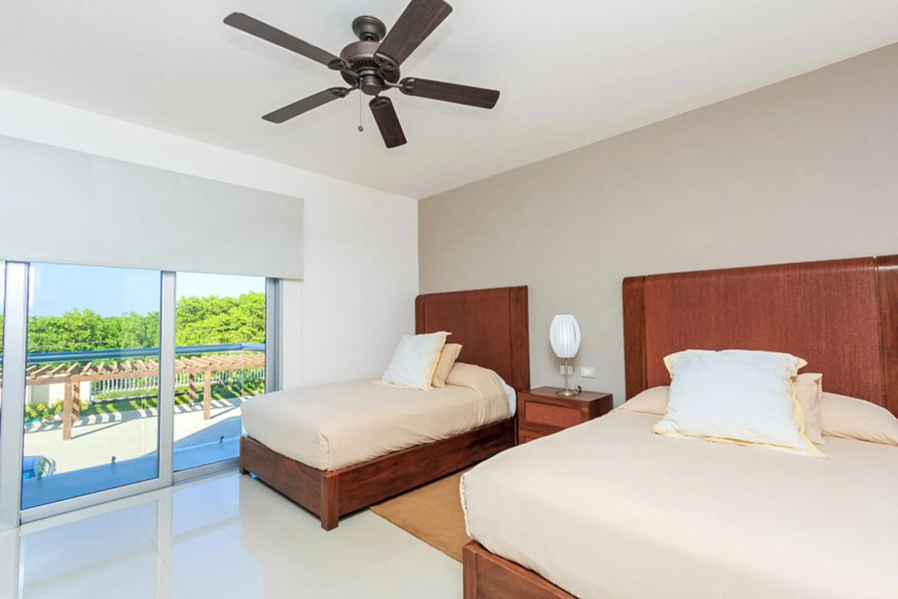 Bed in Luxury Condos at Mareazul Beachfront Complex with Resort-Style Amenities