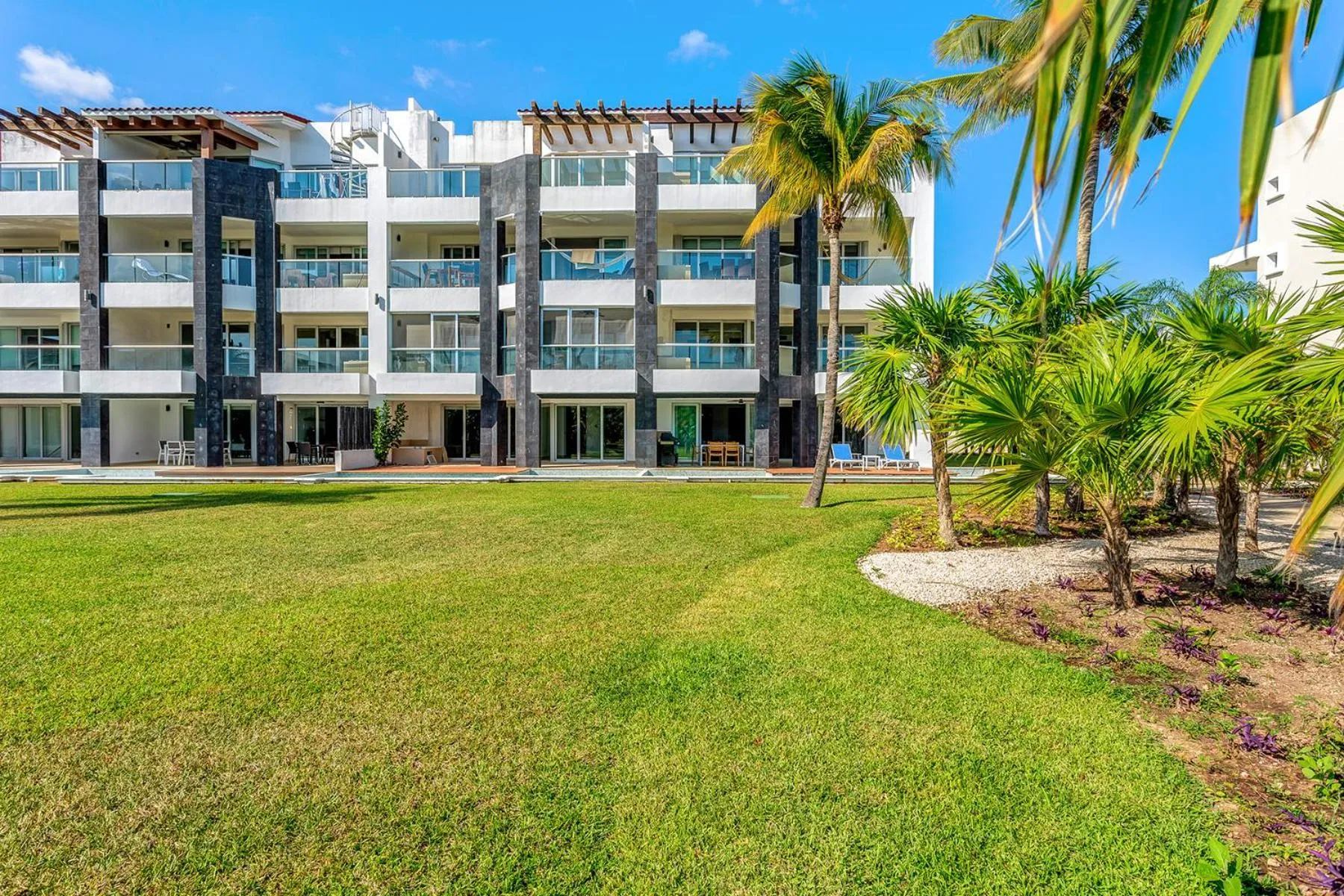 Property building in Luxury Condos at Mareazul Beachfront Complex with Resort-Style Amenities