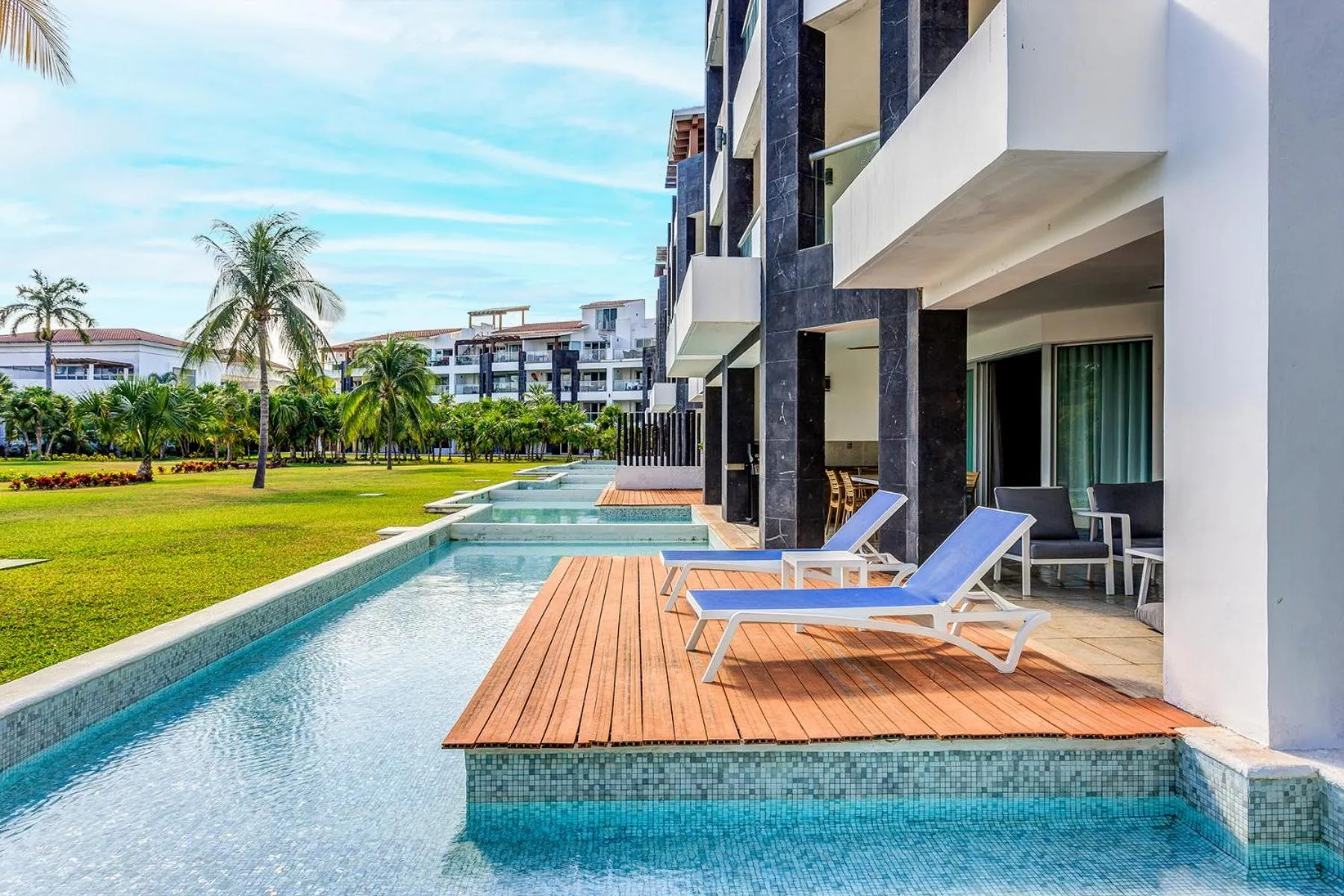 Property building in Luxury Condos at Mareazul Beachfront Complex with Resort-Style Amenities
