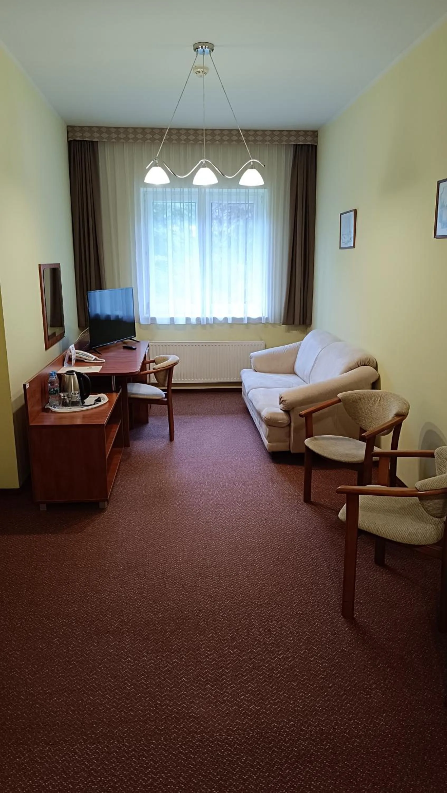 Communal lounge/ TV room in Hotel MCT