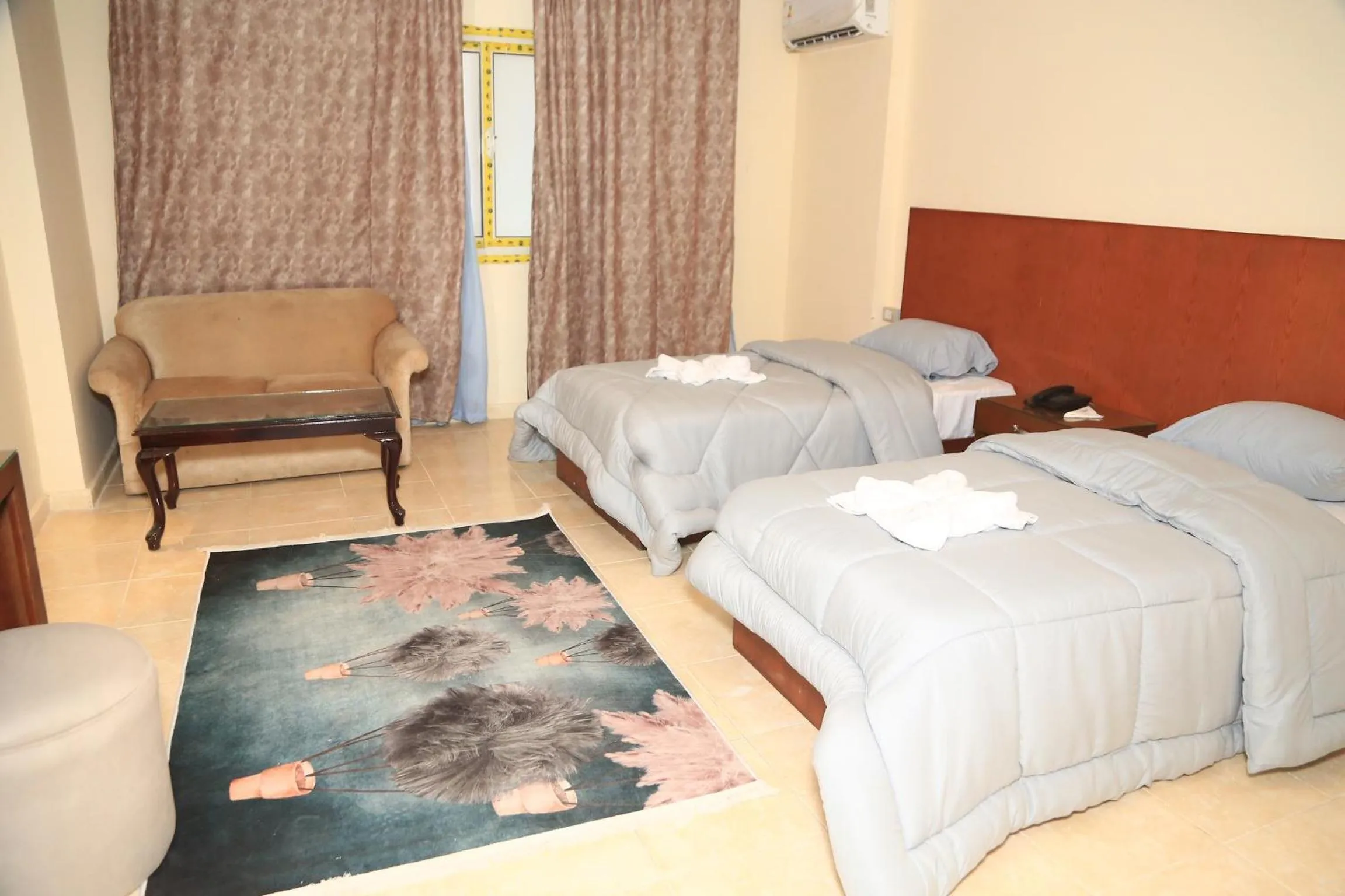 Bed in Verssailles Pyramids Hotel